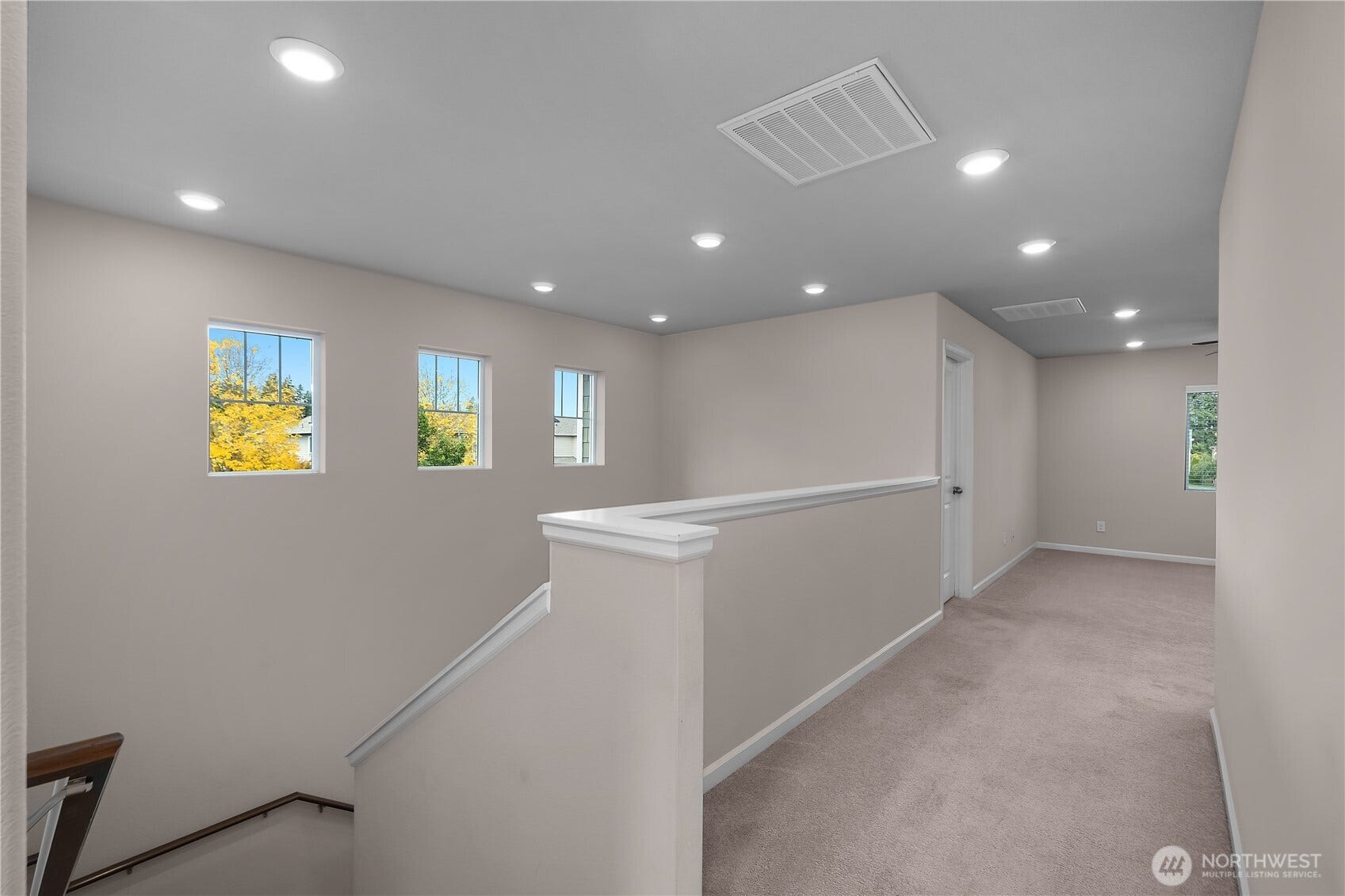 7040 Desperado Drive SE, Tumwater, WA 98501 Upstairs hallway. Far end leads to bonus room and 2 bedrooms and a full bath