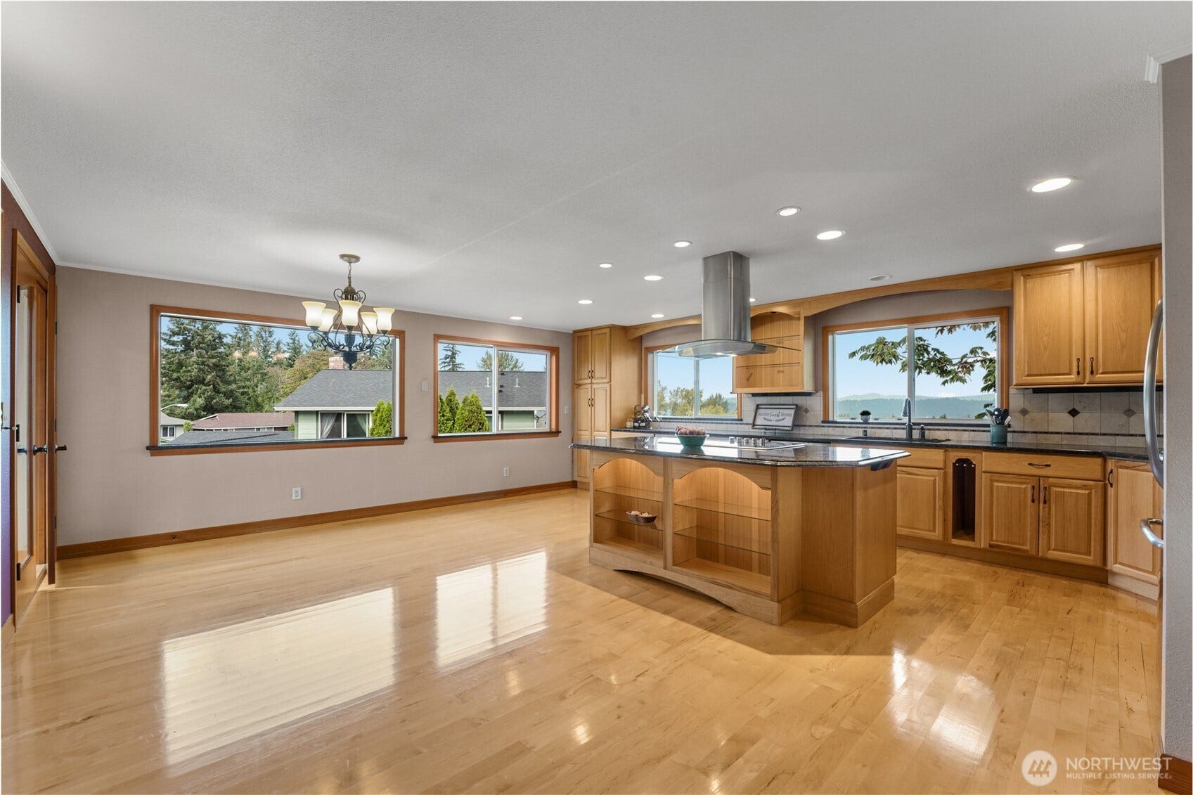 Large picture windows bathe this home in natural light-rain or shine.