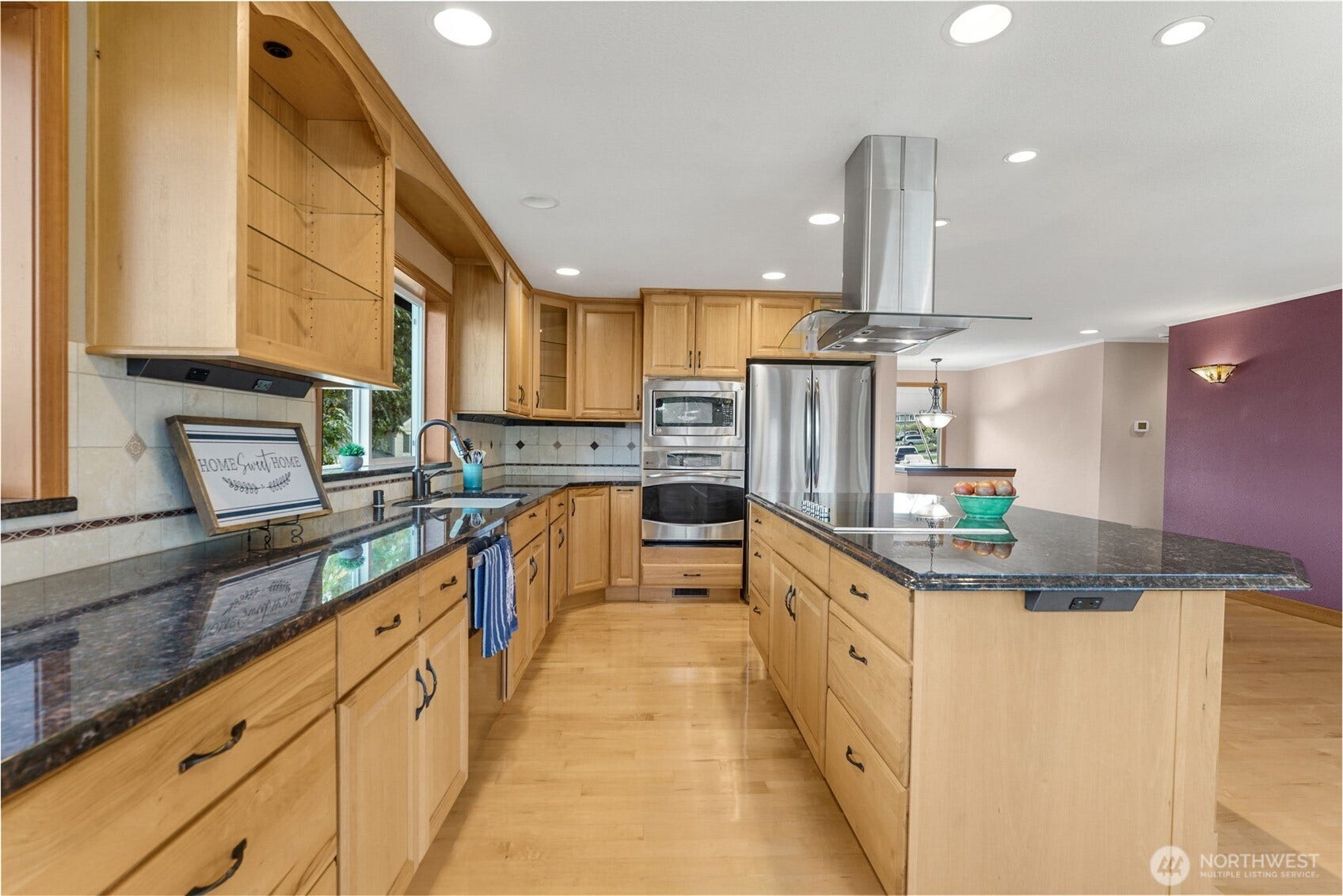 Granite countertops and stainless steel appliances.