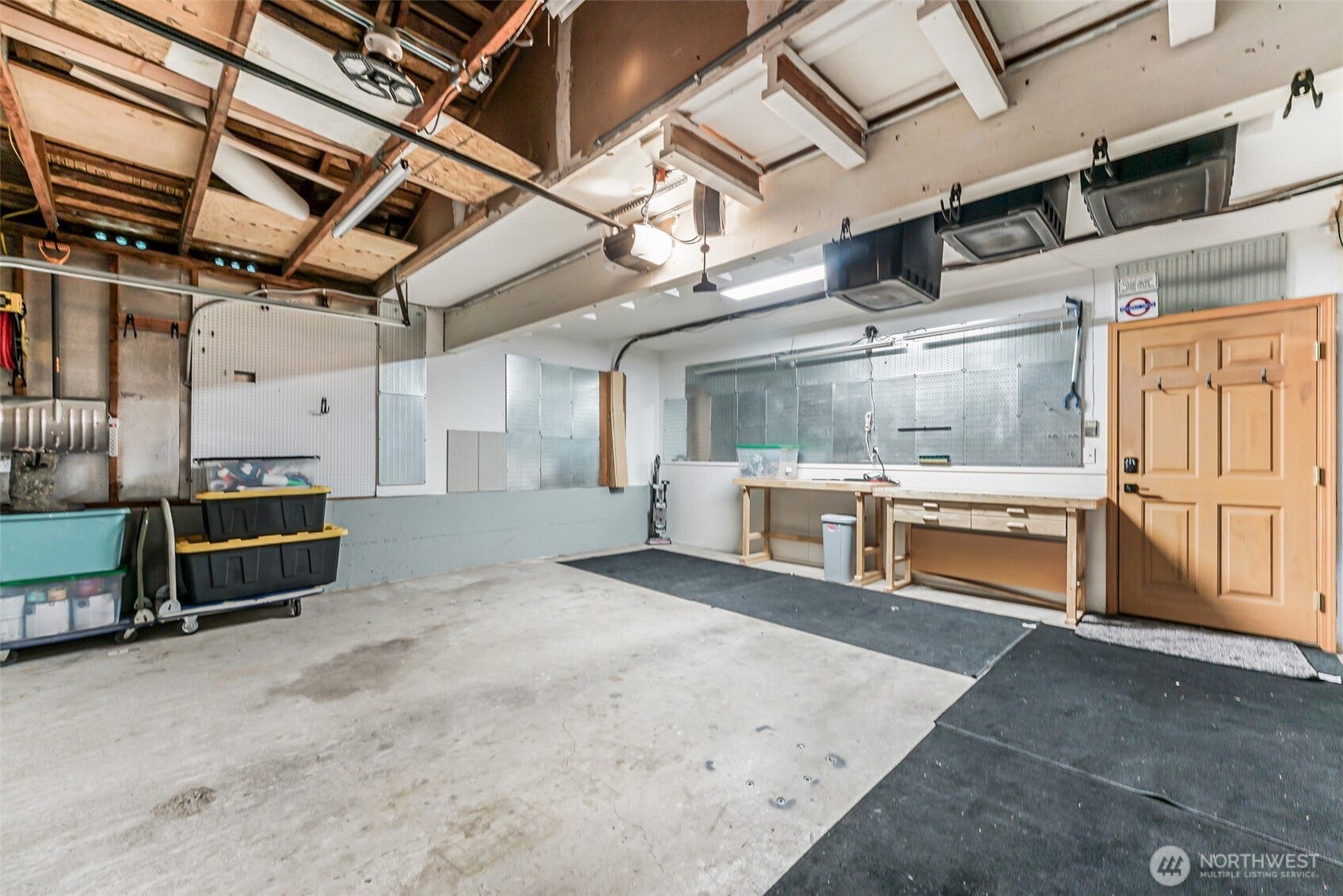Work space and plenty of storage in the garage.