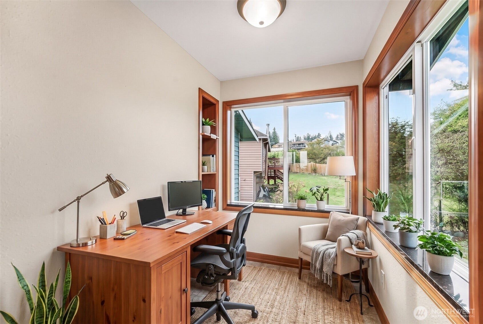 This sunroom could make a good office. Virtually staged.