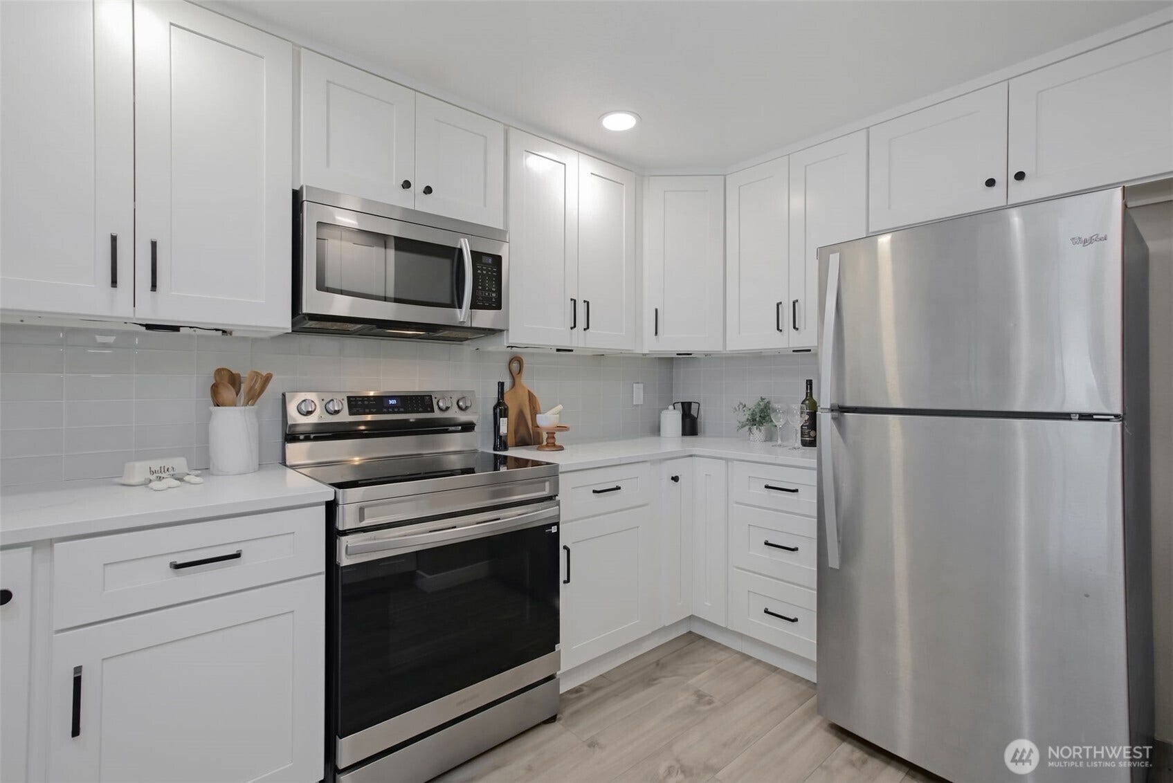 Modern cabinetry and newer stainless steel appliances make for an easy cooking experience