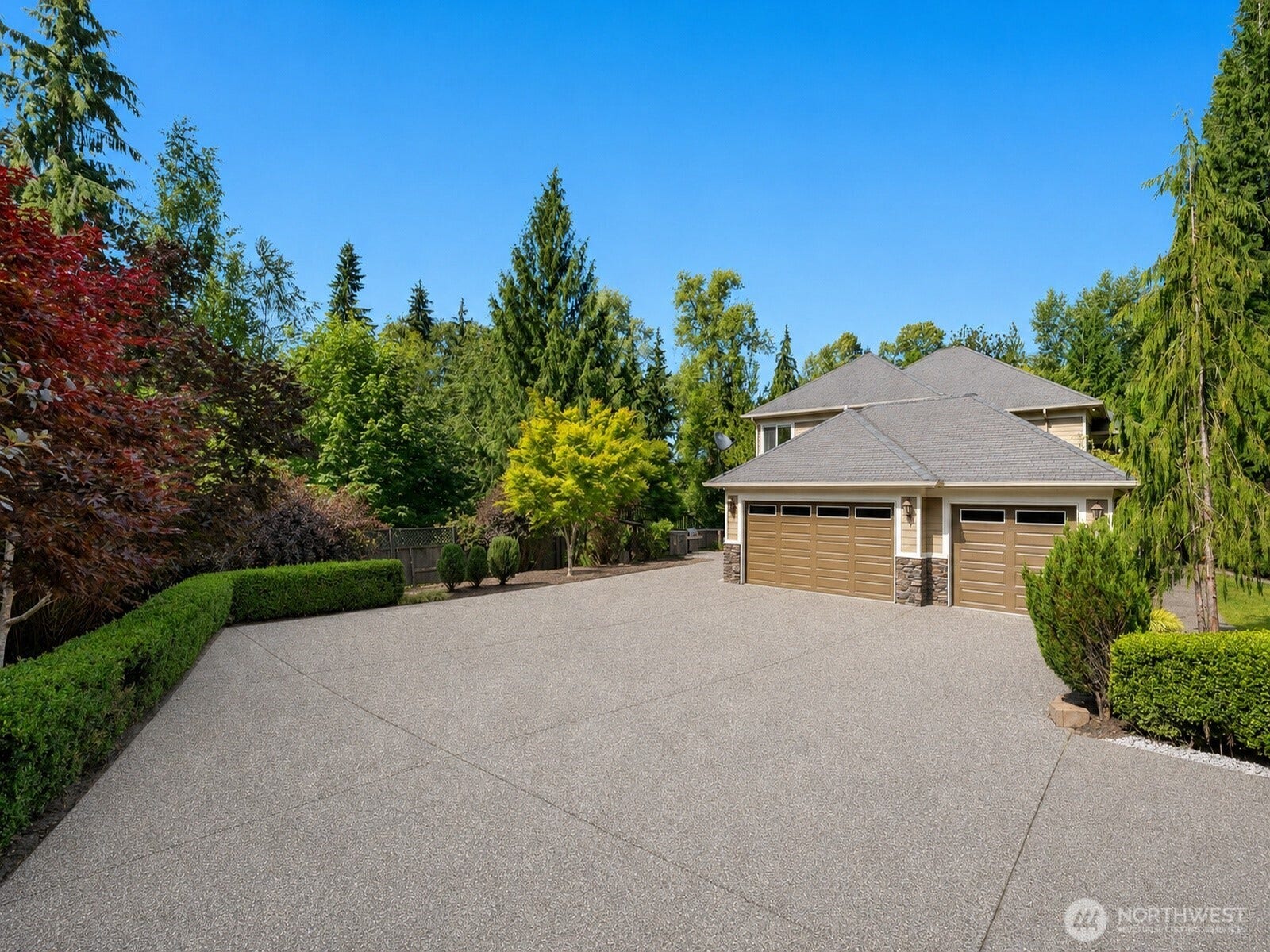 Expansive driveway with 3 car garage