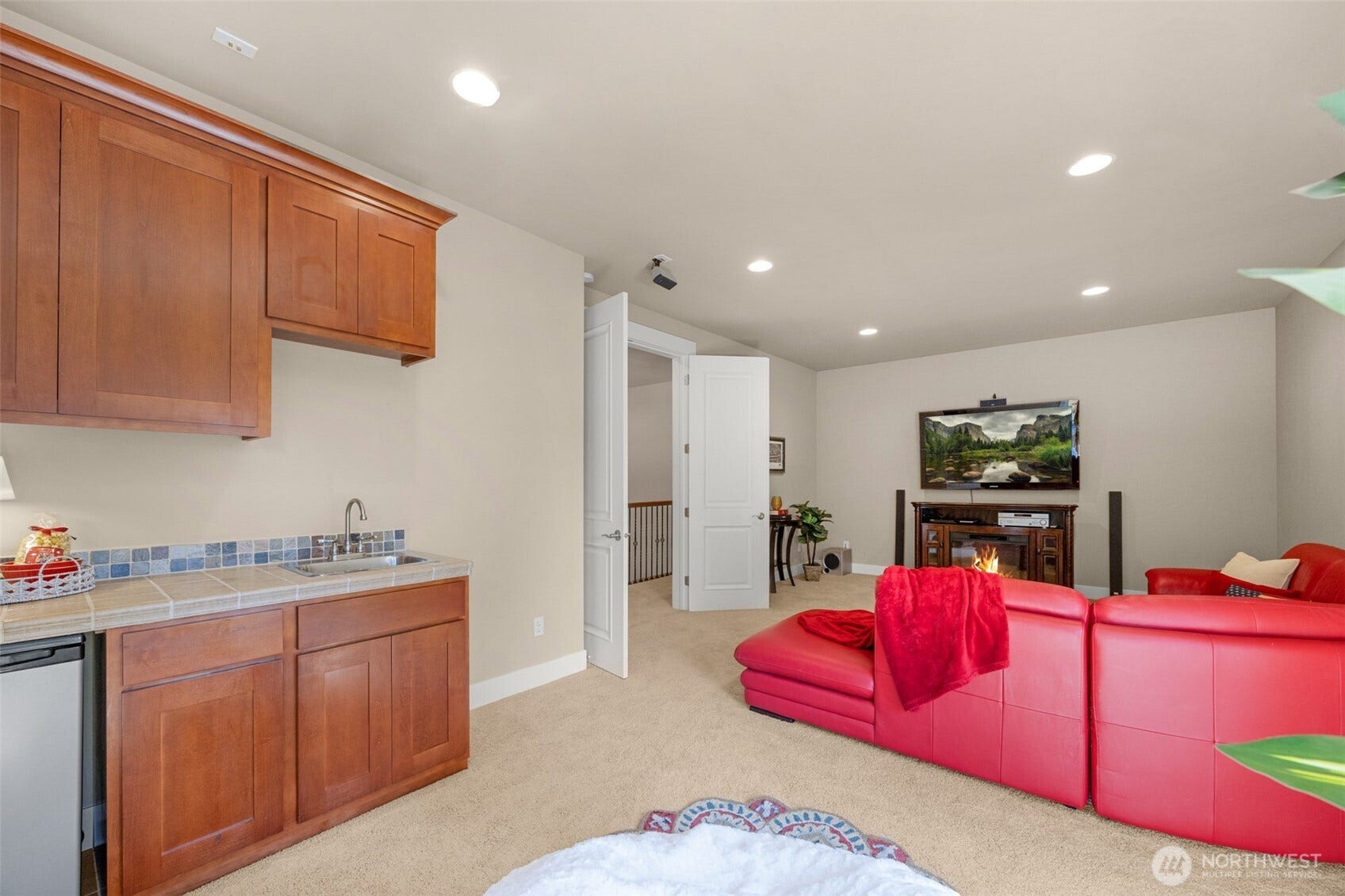 Large media room with wet bar.