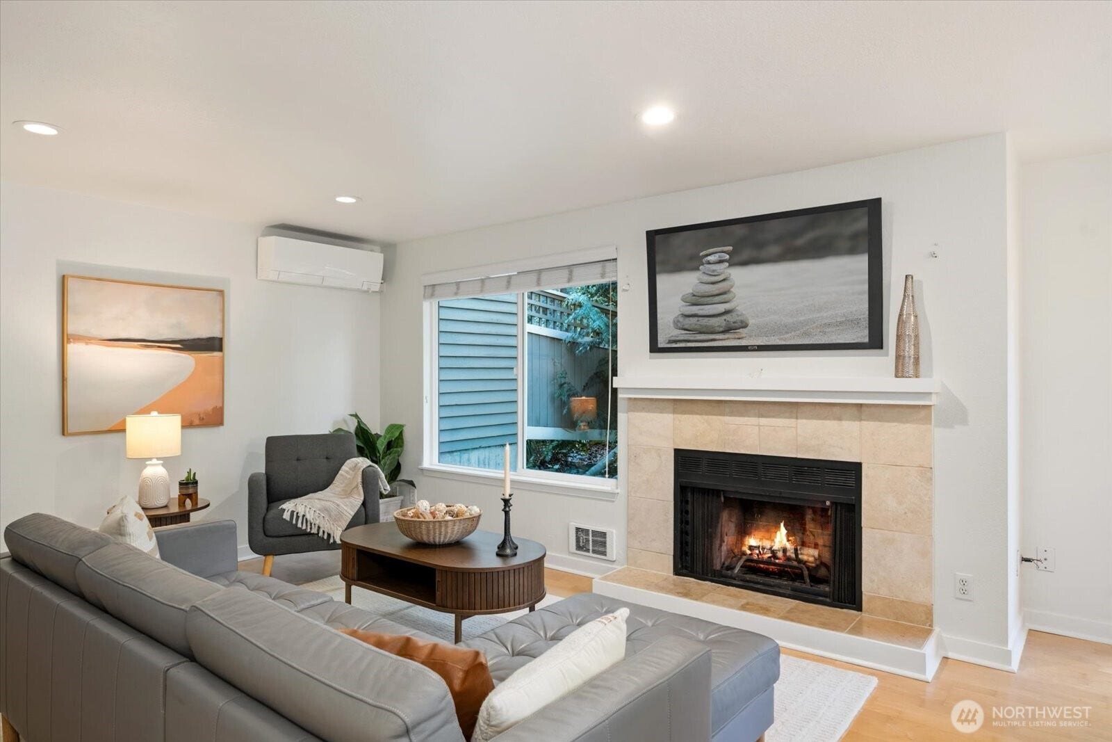 11411 102nd Court NE, Kirkland, WA 98033 Large windows bring in abundant natural light and a peaceful outlook toward greenery.