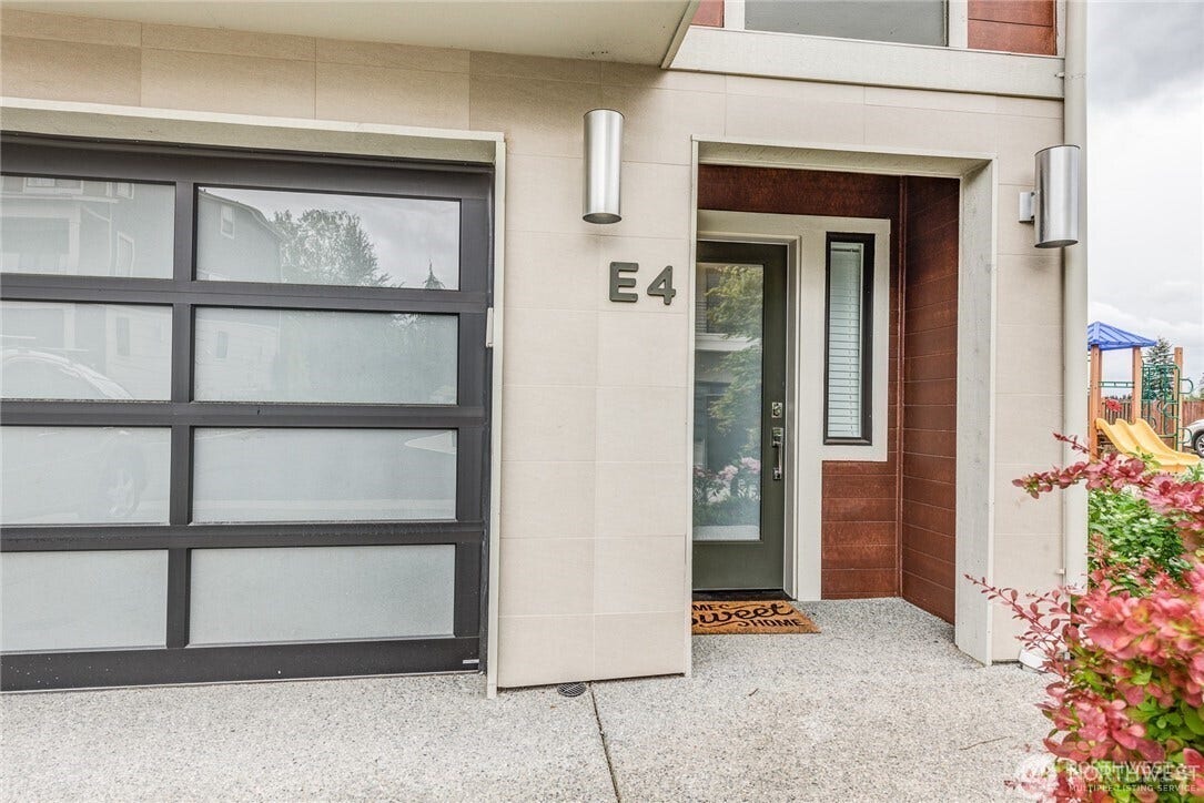 Front of townhome with 2 car garage