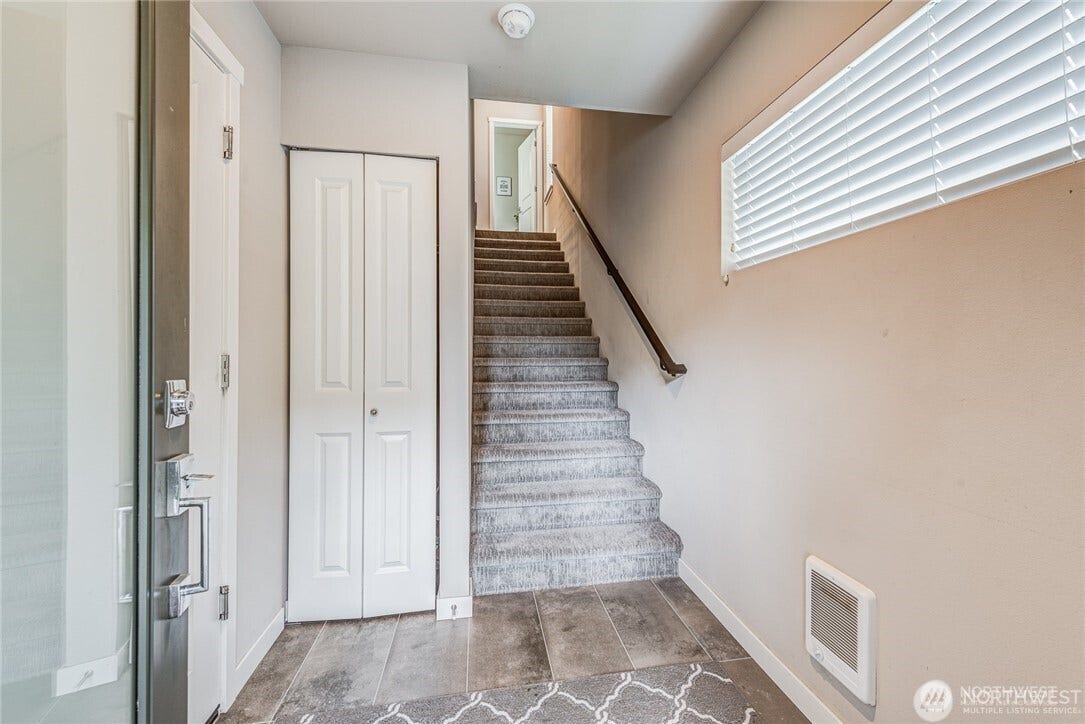 Entrance of townhome with entrance to garage