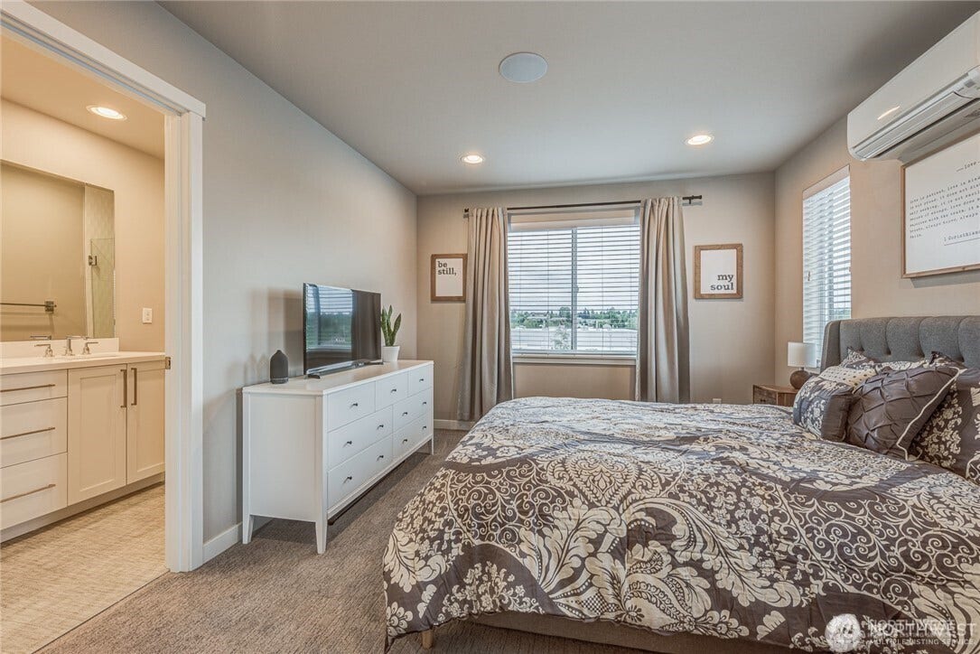 Primary bedroom with walk in closet