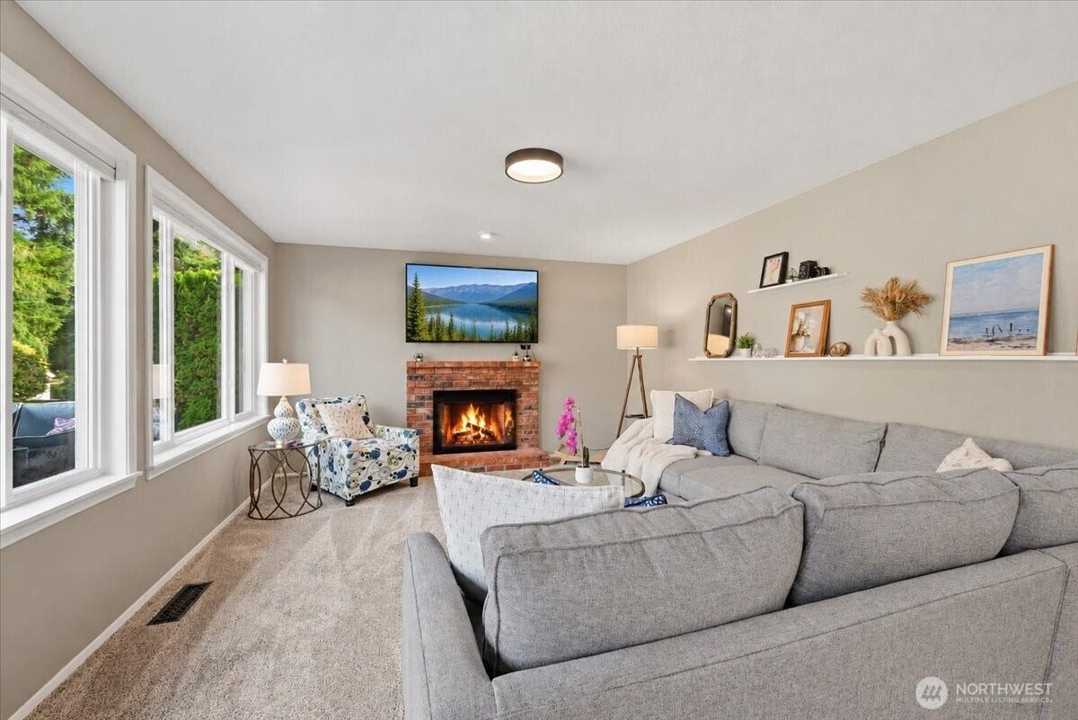 3623 125th Place SE, Everett, WA 98208 Cozy wood burning fireplace in family room with oversized windows bring in natural light.