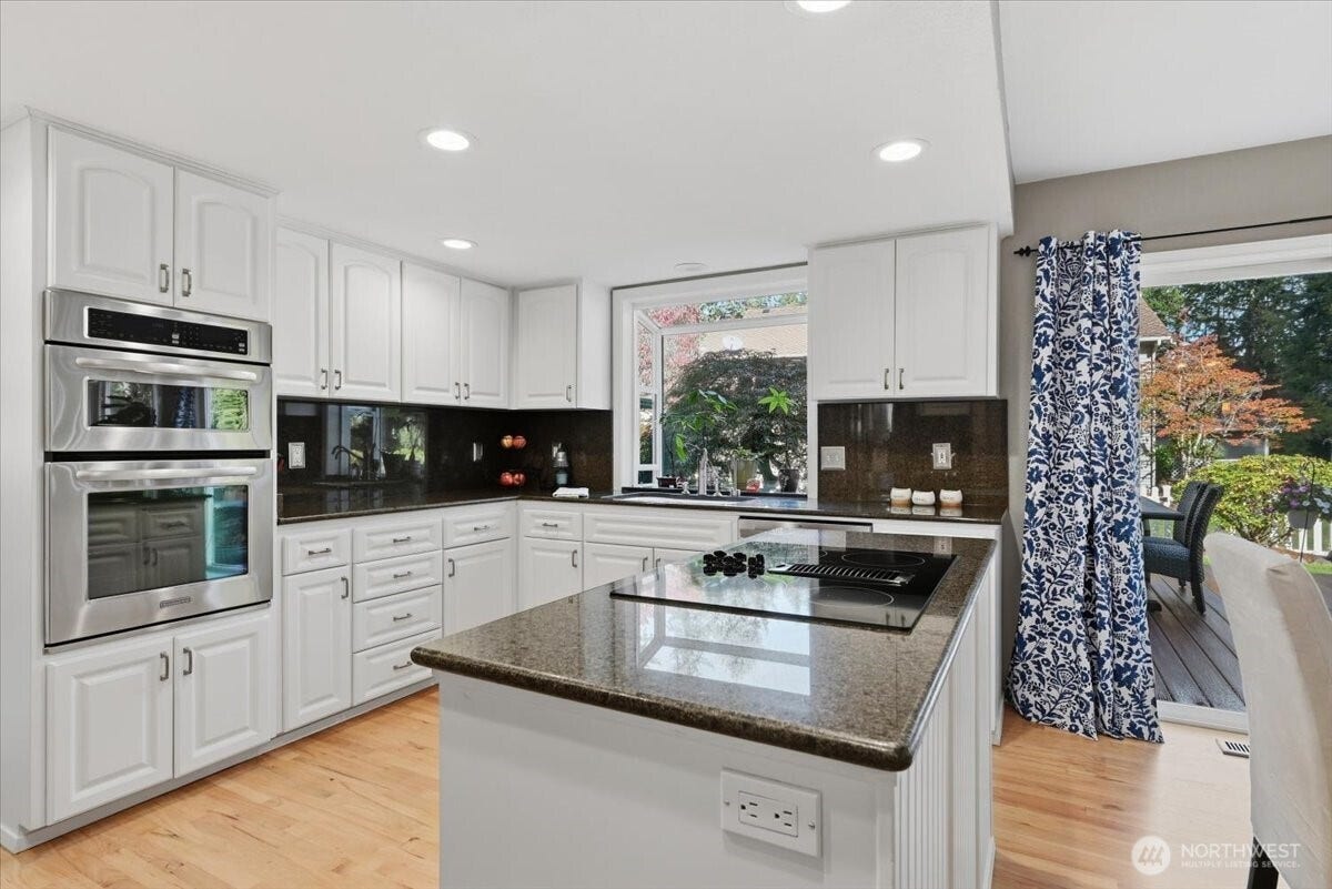 3623 125th Place SE, Everett, WA 98208 Light and bright kitchen with glass cooktop in island.