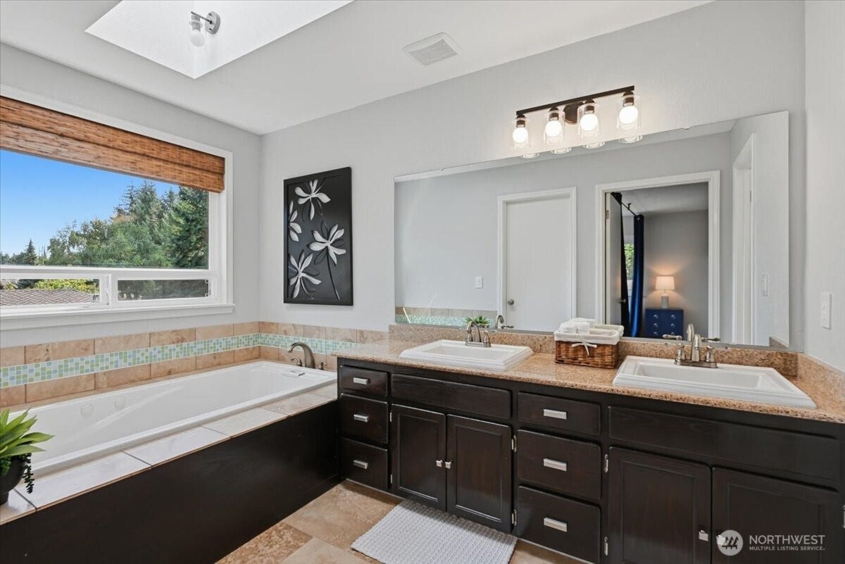 3623 125th Place SE, Everett, WA 98208 Primary bathroom with double vanity, jetted tub and separate shower, toilet, and walk in closet.