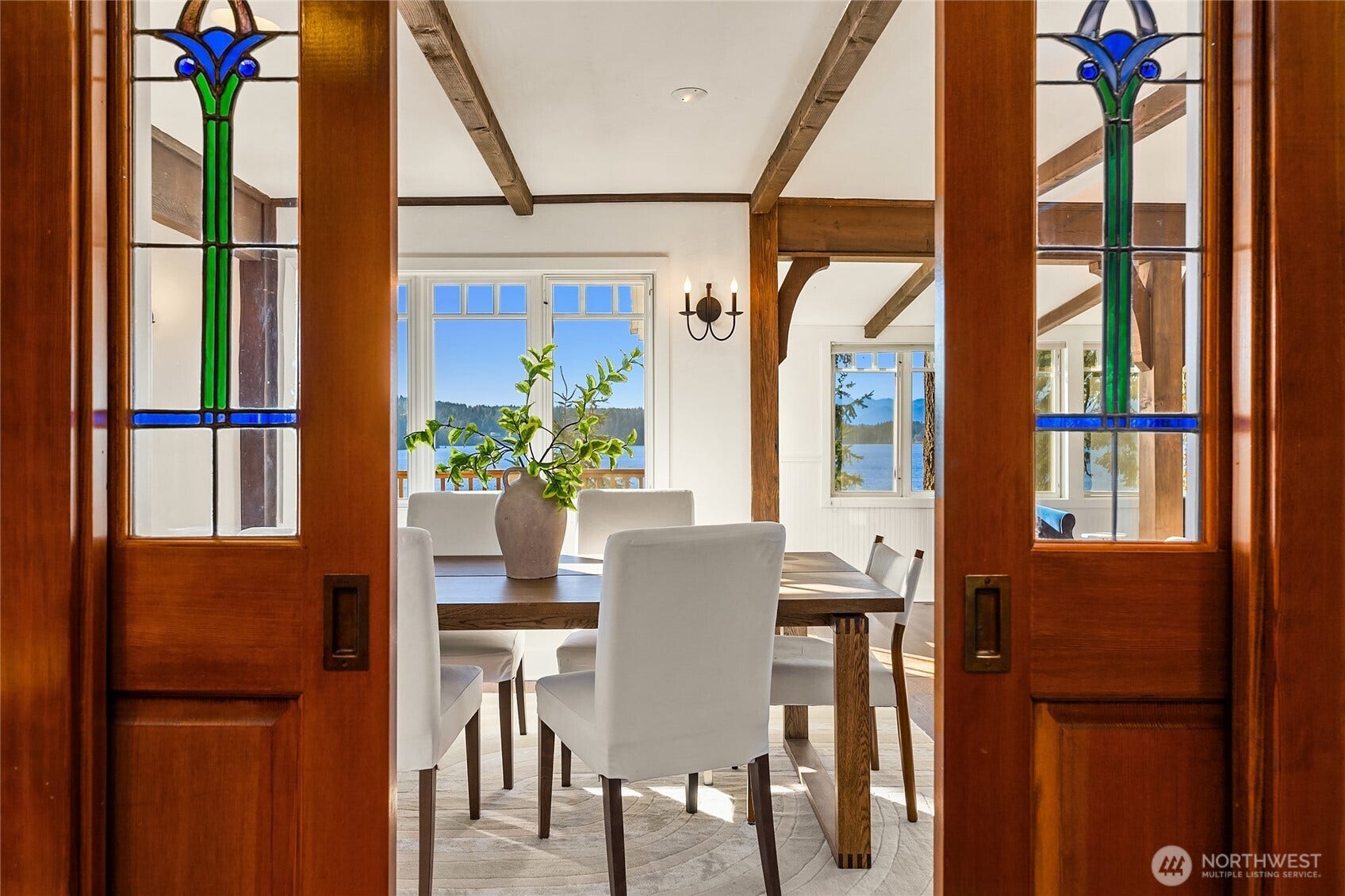 8405 Hansen Road NE, Bainbridge Island, WA 98110 Looking from the kitchen to the dining through the pocket doors.