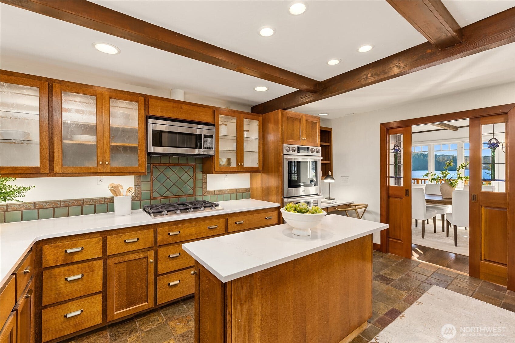 8405 Hansen Road NE, Bainbridge Island, WA 98110 The well appointed kitchen with updated appliances and quartz countertops.