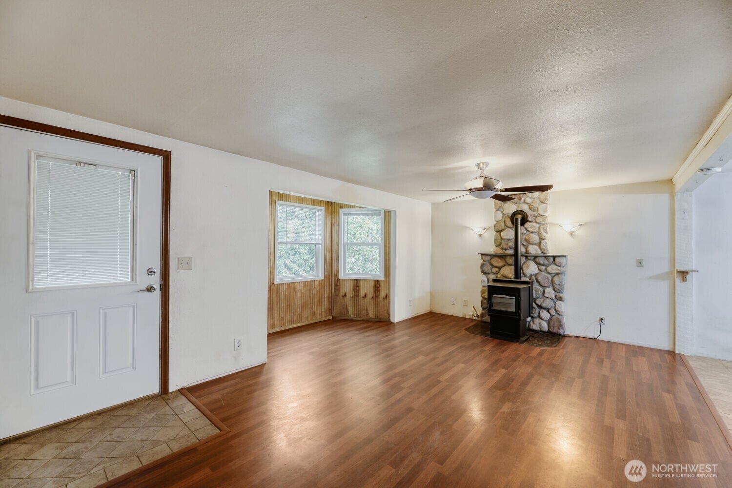 Living Room with Bay Window and Pellet Stove.