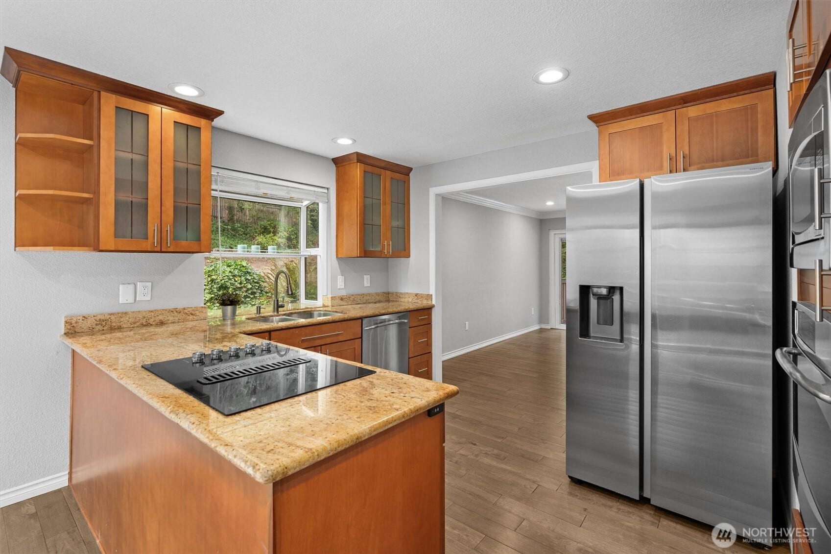 Kitchen with refrigerator purchased in 2025.