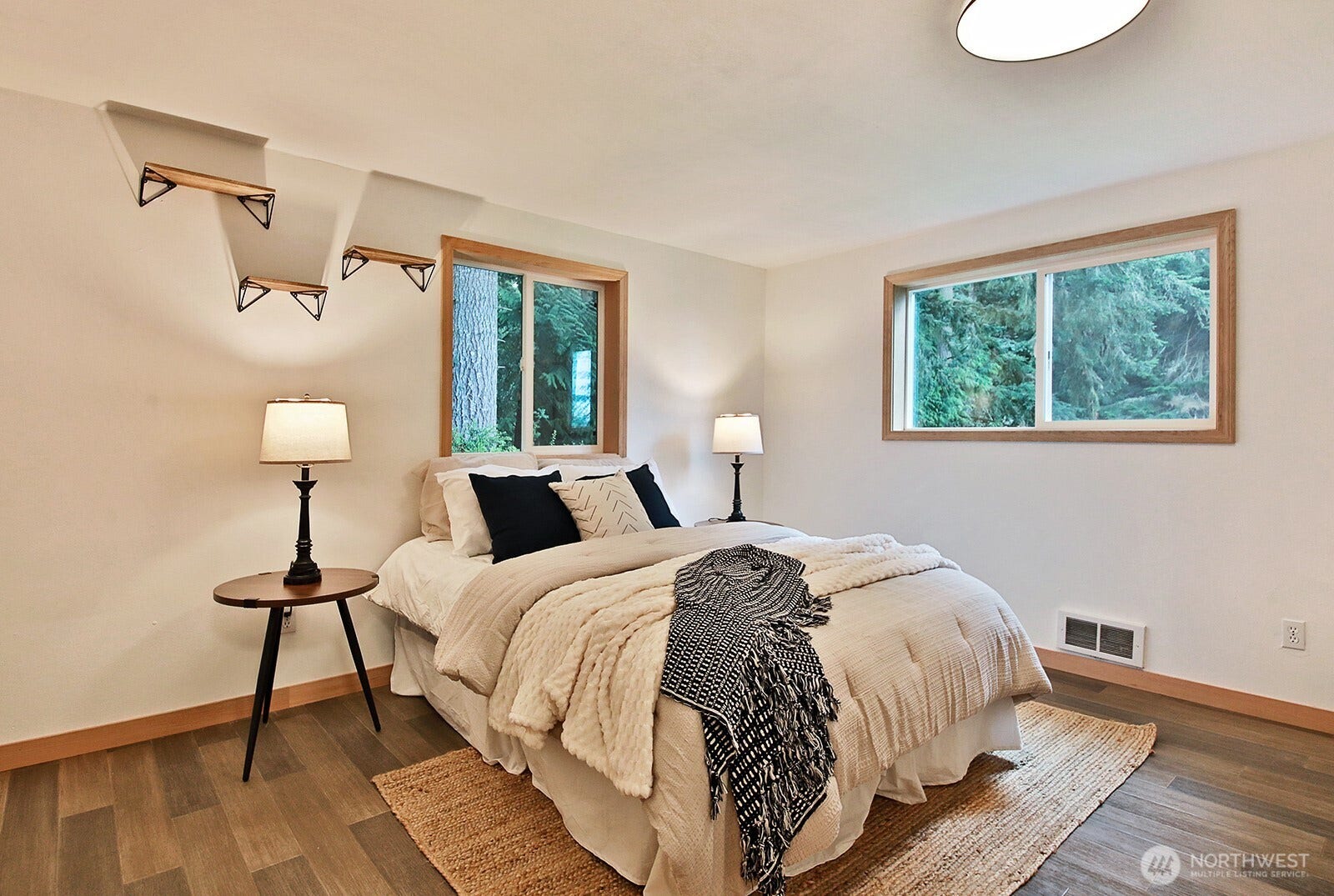 We are back on the main level and this is the more spacious of the two bedrooms on the main level.