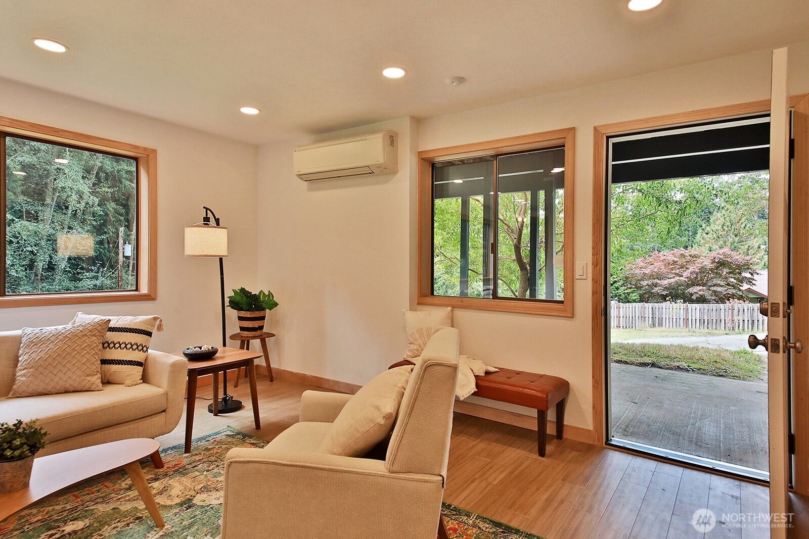 A small patio area is located at the entrance of the lower level.