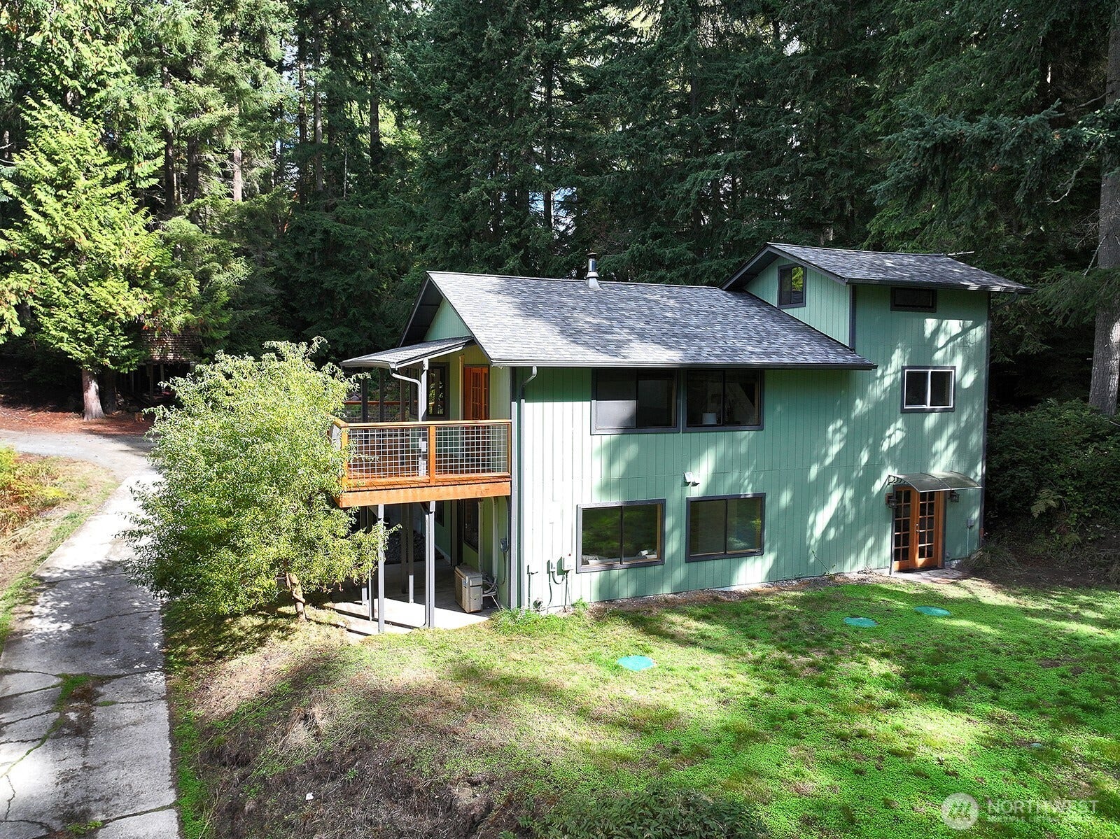 Great perspective of the levels of possibility that live here. Main level has kitchen/living/dining, 2 bedrooms, full bath. Lower level is currently Primary Suite, family room & an office. There is a 3rd level, a loft space. Lower level French doors (along the right edge of house) is the Primary Suite.
