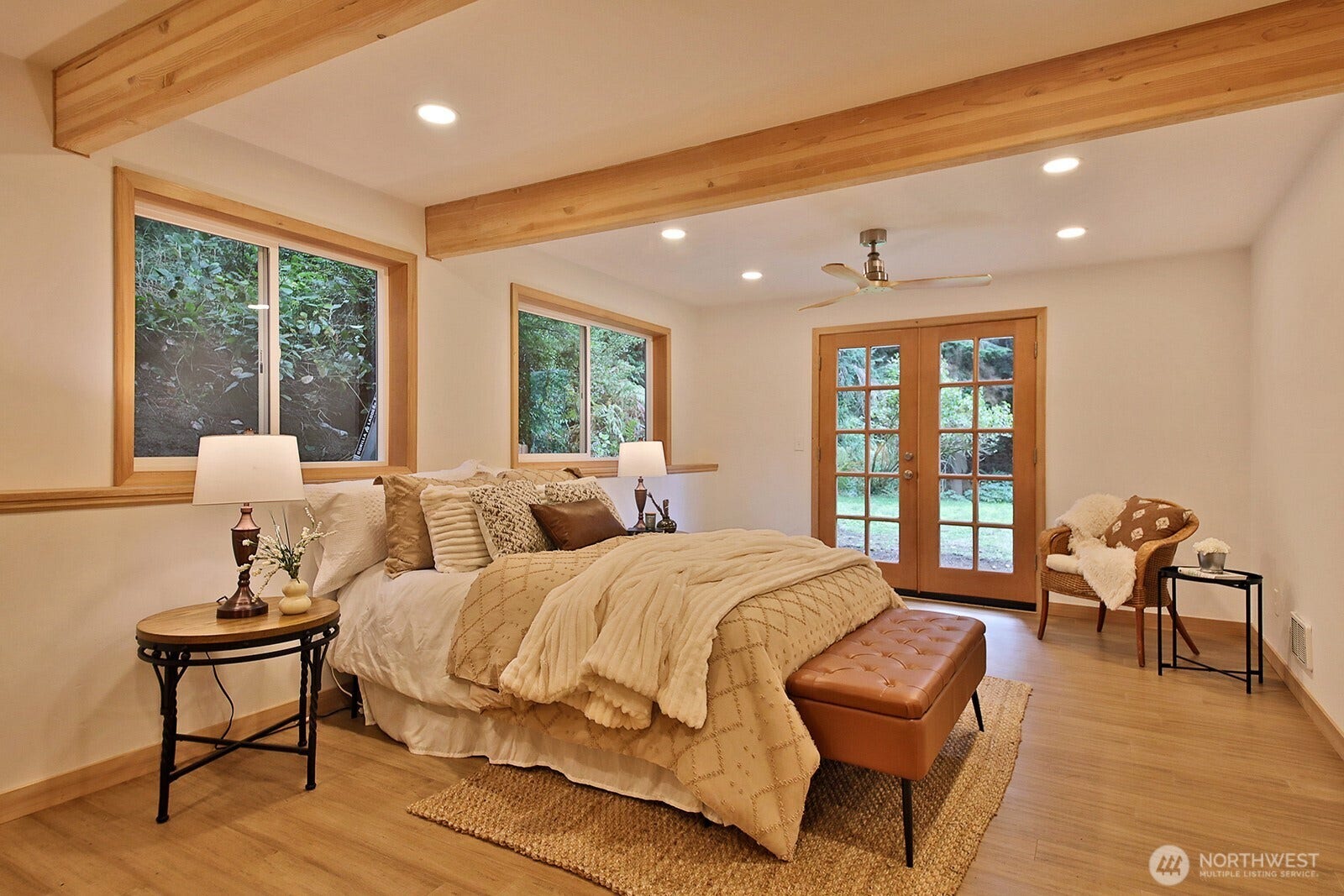 The Primary Suite is very spacious. French doors lead to the yard.