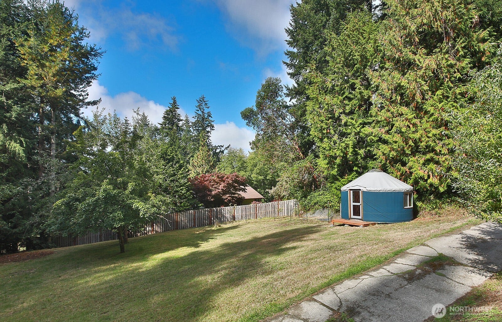 Plenty of yard space, an apple tree and an Asian pear, too! A young apple tree and two cherry trees have been planted during seller's ownership.