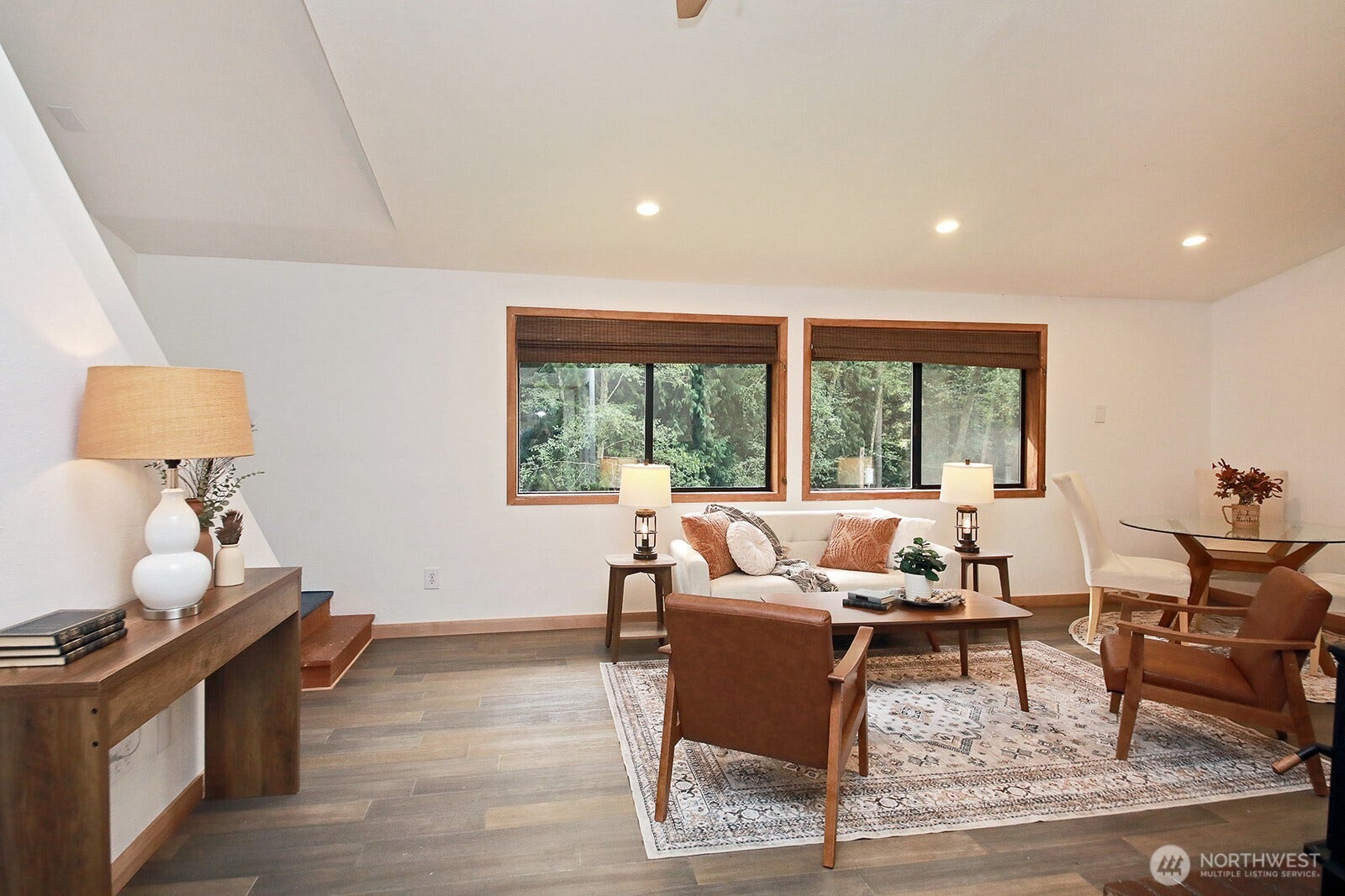 Vaulted ceilings, bamboo flooring, generous windows, and freshly painted. Stairs to the loft are along the left edge of this photo. The main entrance is to the photographer's back.