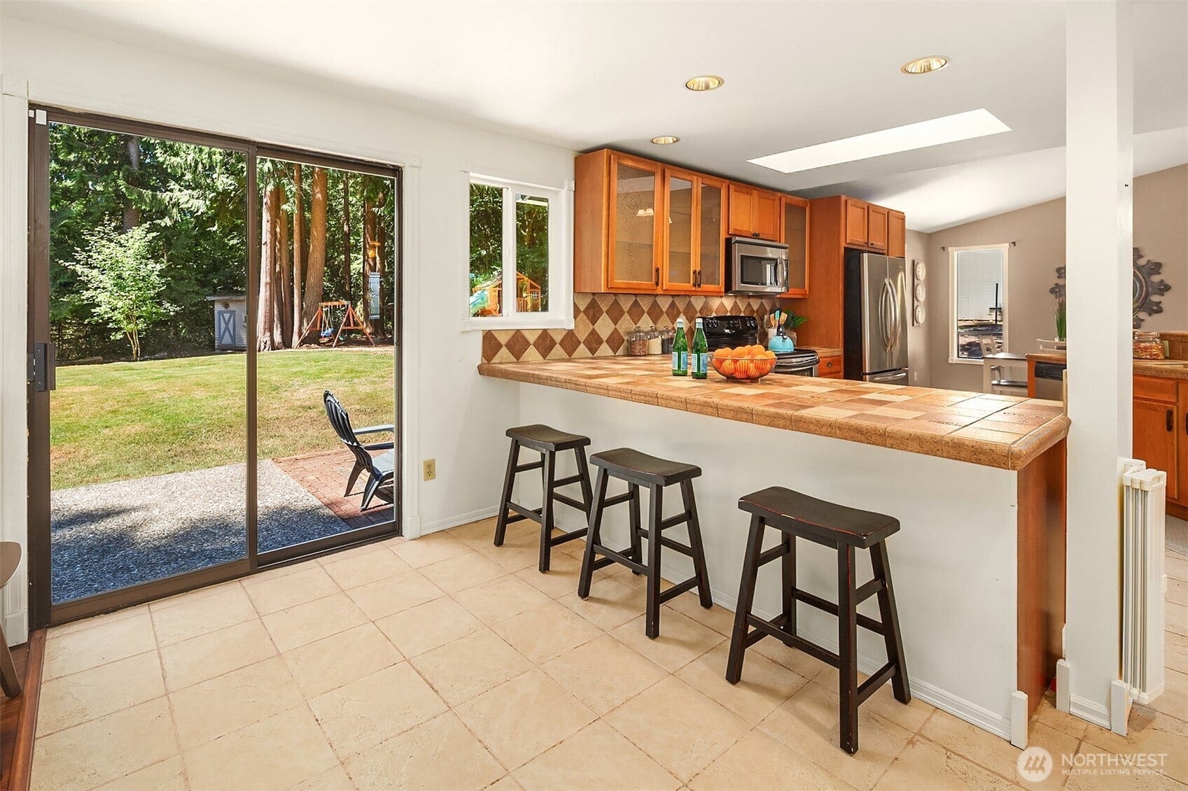 1247 293rd Avenue NE, Carnation, WA 98014 Pull up a stool to the kitchen or head out the slider to the patio.