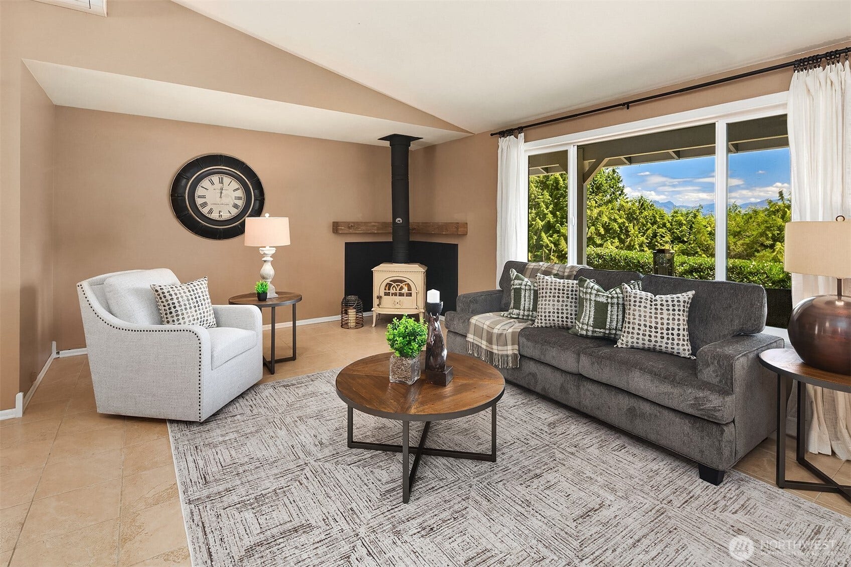 1247 293rd Avenue NE, Carnation, WA 98014 There is a wood burning stove in the living room section.