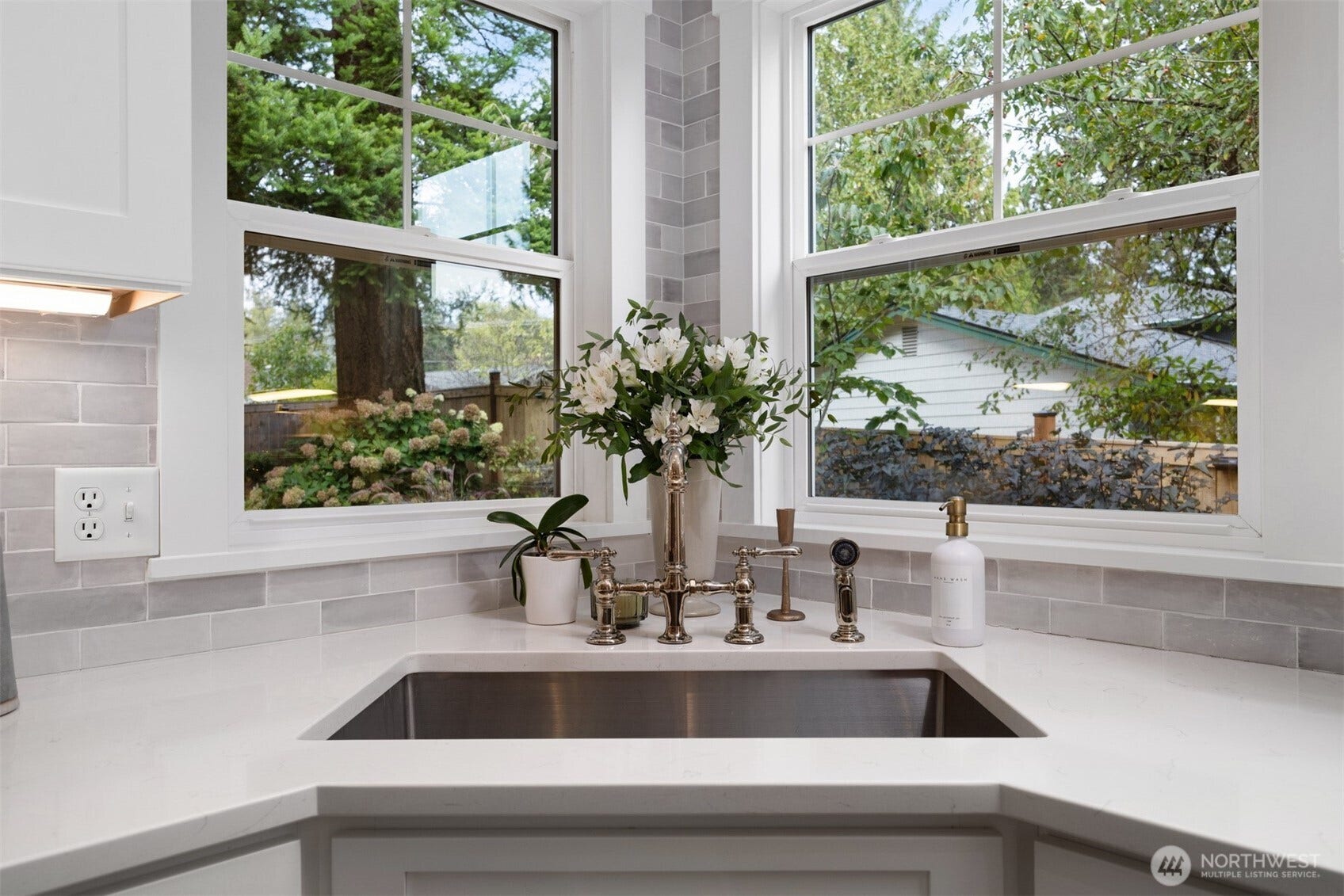 3793 Greenville Place, Bellingham, WA 98226 The kitchen sink is very deep and has an amazing designer Kohler faucet and looks the gorgeous landscape in the rear yard.