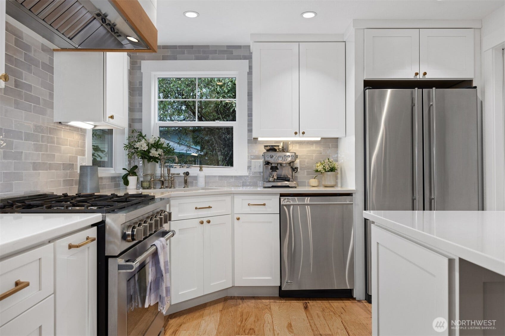 3793 Greenville Place, Bellingham, WA 98226 There is a great work triangle with an industrial gas range and concealed industrial exhaust hood.