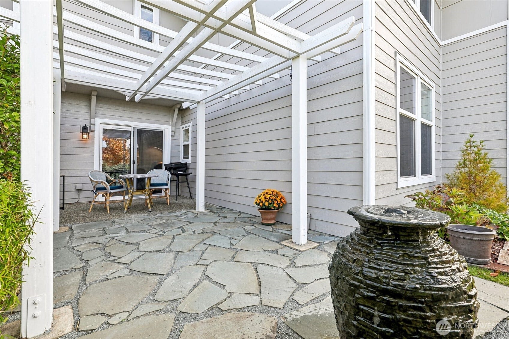 22475 SE 38th Terrace, #1418, Issaquah, WA 98029 Stone Pavers, Pergola, Water feature and pots are owners to enjoy