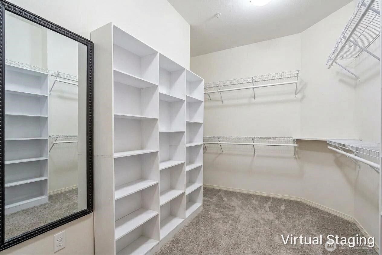 22475 SE 38th Terrace, #1418, Issaquah, WA 98029 Bedroom 2 has a huge walk in closet with some custom organizers