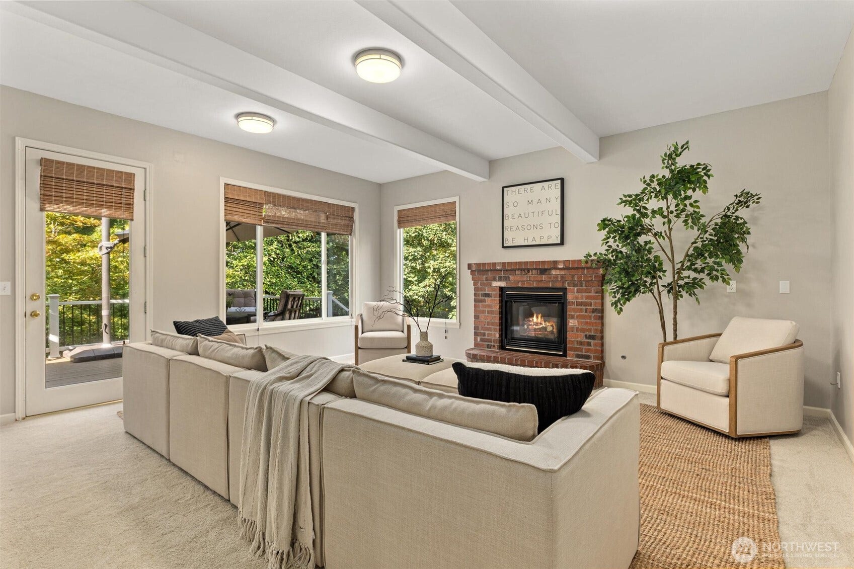 19141 148th Avenue NE, Woodinville, WA 98072 Spacious great room off kitchen with cozy fireplace. Door leads out to trek deck
