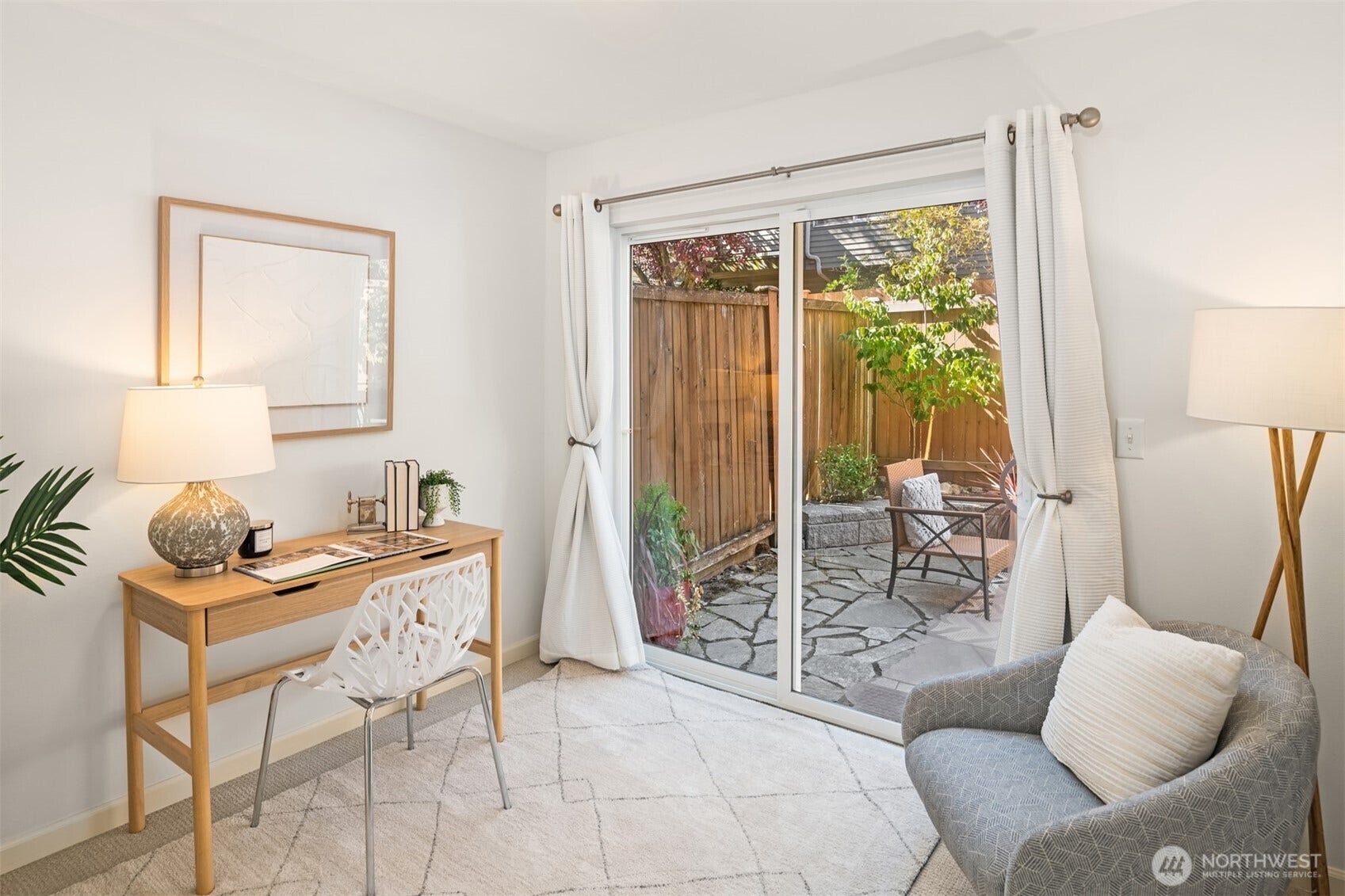 8521 Interlake Avenue N, #B, Seattle, WA 98103 Ground-floor 3rd bedroom with a slider to the stone patio and fenced backyard.