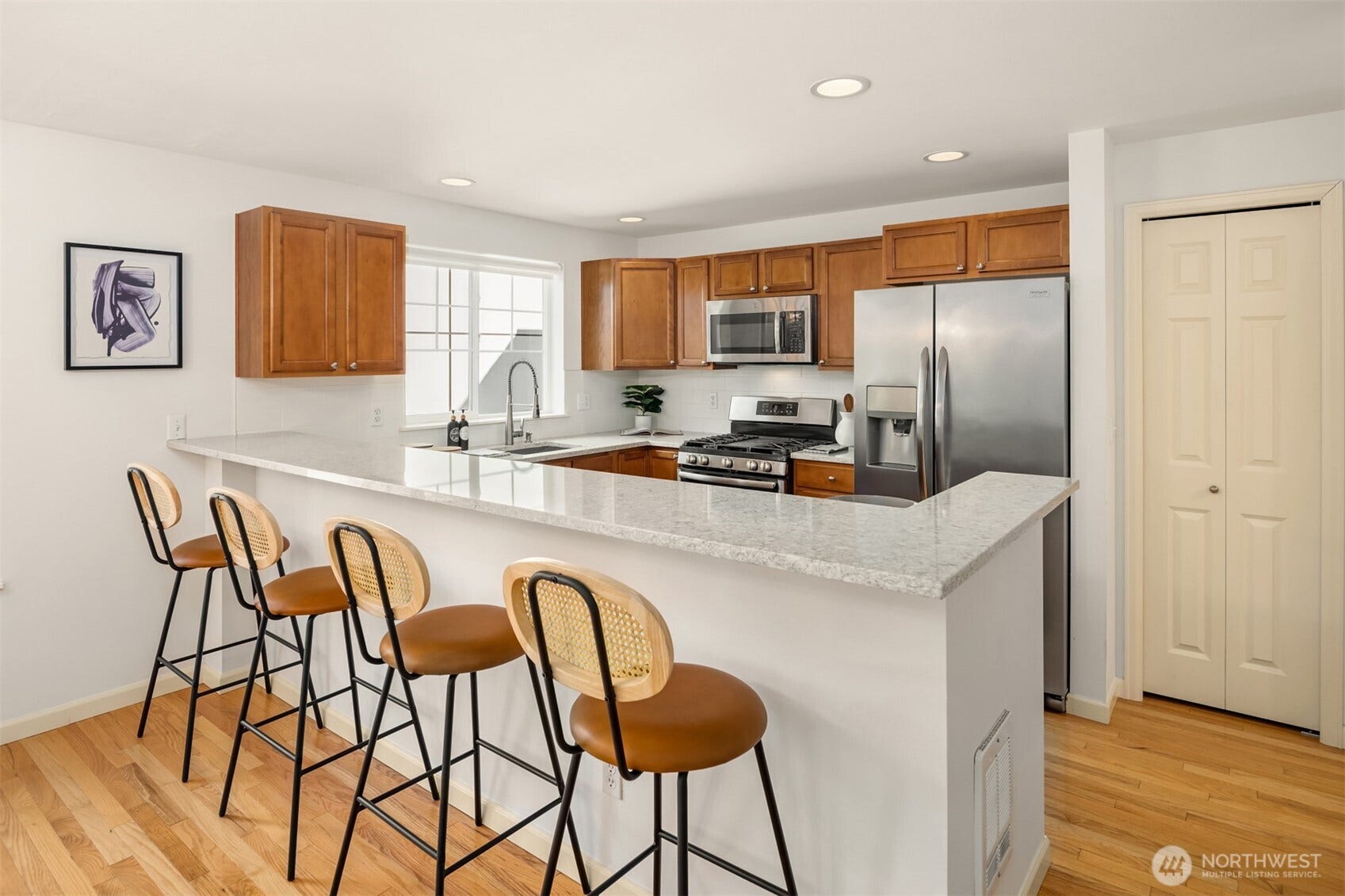 8521 Interlake Avenue N, #B, Seattle, WA 98103 The kitchen offers loads of storage, a gas range, and countertop seating so your friends can belly up to the bar while you're whipping up a meal.