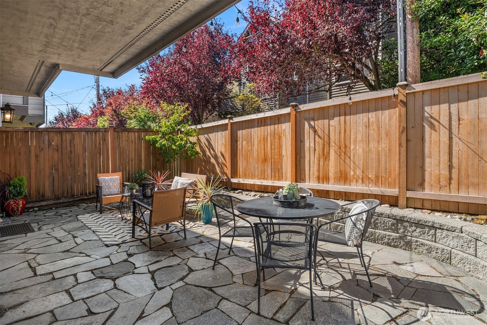 8521 Interlake Avenue N, #B, Seattle, WA 98103 Private, quiet, and fully-fenced. This backyard is ready for you to soak up the fall sunshine!