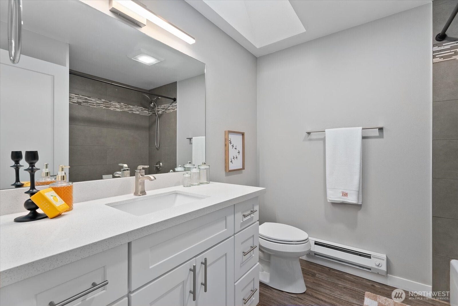 12728 NE 132nd Place, Kirkland, WA 98034 Guest bathroom with full bathtub and skylight.