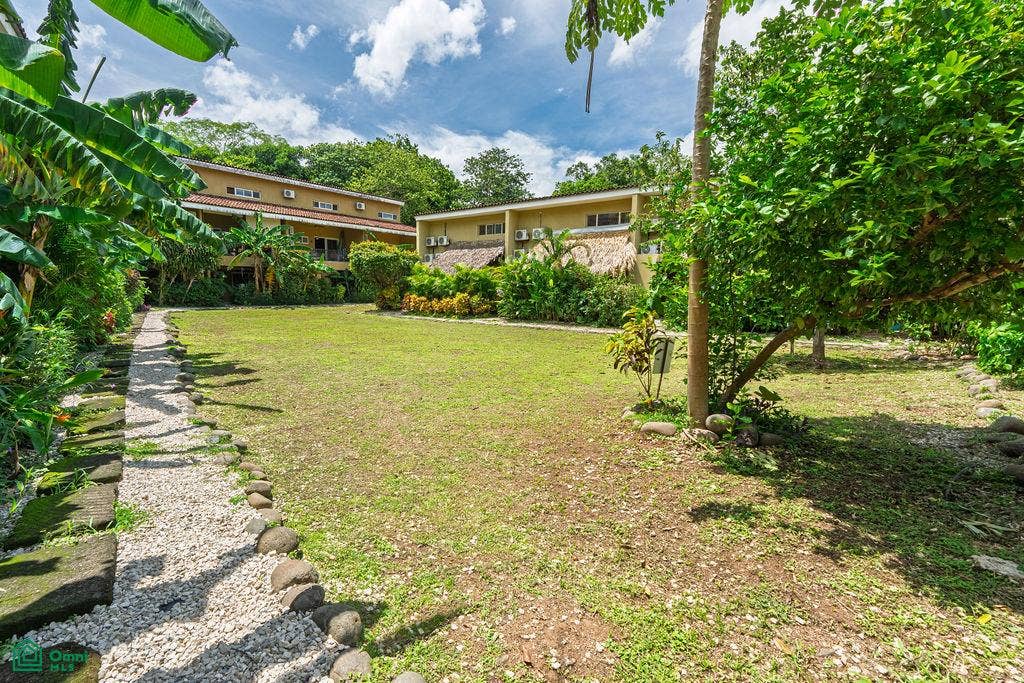 La Iguana Dorada Fully Furnished Condo - Near Playa Grande, Playa Grande, Cabo Velas, Santa Cruz, Guanacaste, Costa Rica 50309 Landscaped green spaces and residential buildings within Cabo Velas Estates.