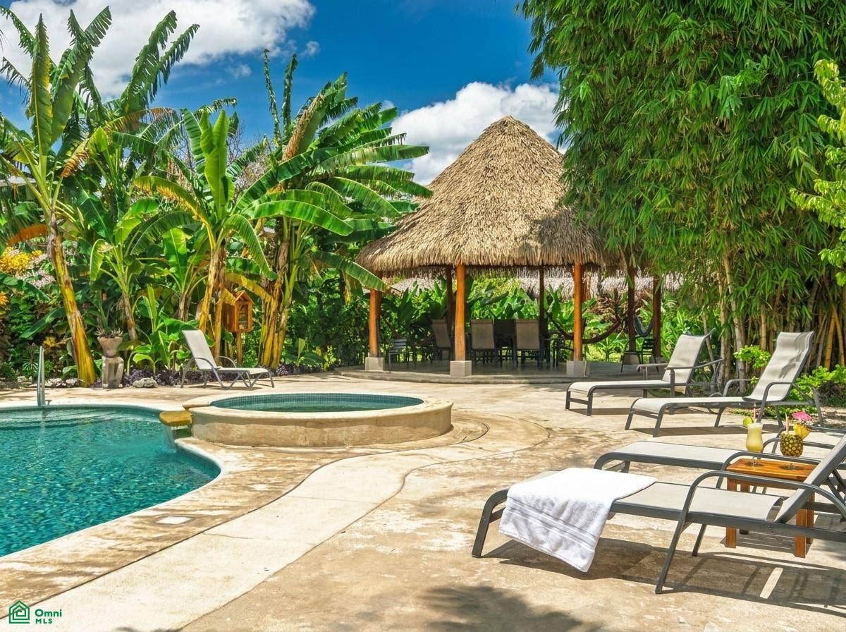 La Iguana Dorada Fully Furnished Condo - Near Playa Grande, Playa Grande, Cabo Velas, Santa Cruz, Guanacaste, Costa Rica 50309 Resort-style community pool surrounded by lush tropical landscaping.