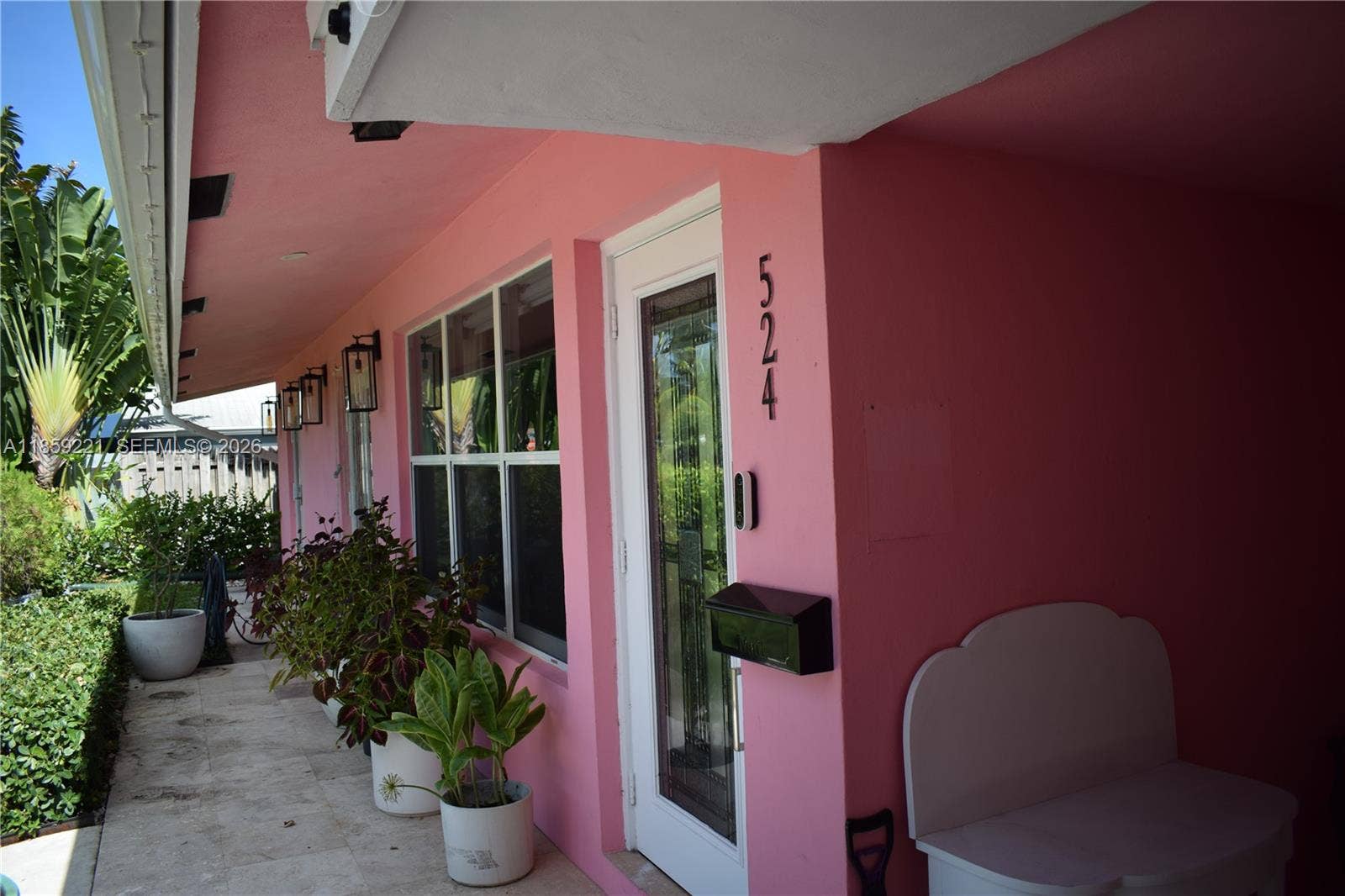 524 NE 27th Drive, Wilton Manors, FL 33334 A generous, tidy pathway through the landscaped private garden welcomes you into the home with style and serenity