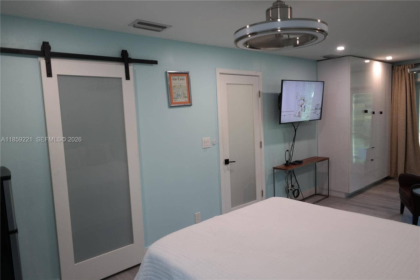 524 NE 27th Drive, Wilton Manors, FL 33334 Oversized bedroom with generous space, dual ceiling fans, and direct access to the bathroom for added convenience