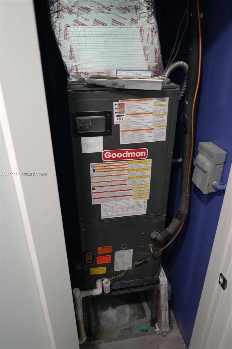 524 NE 27th Drive, Wilton Manors, FL 33334 Modern air handler, under 2 years old, featuring a smart digital thermostat for customizable comfort and energy savings