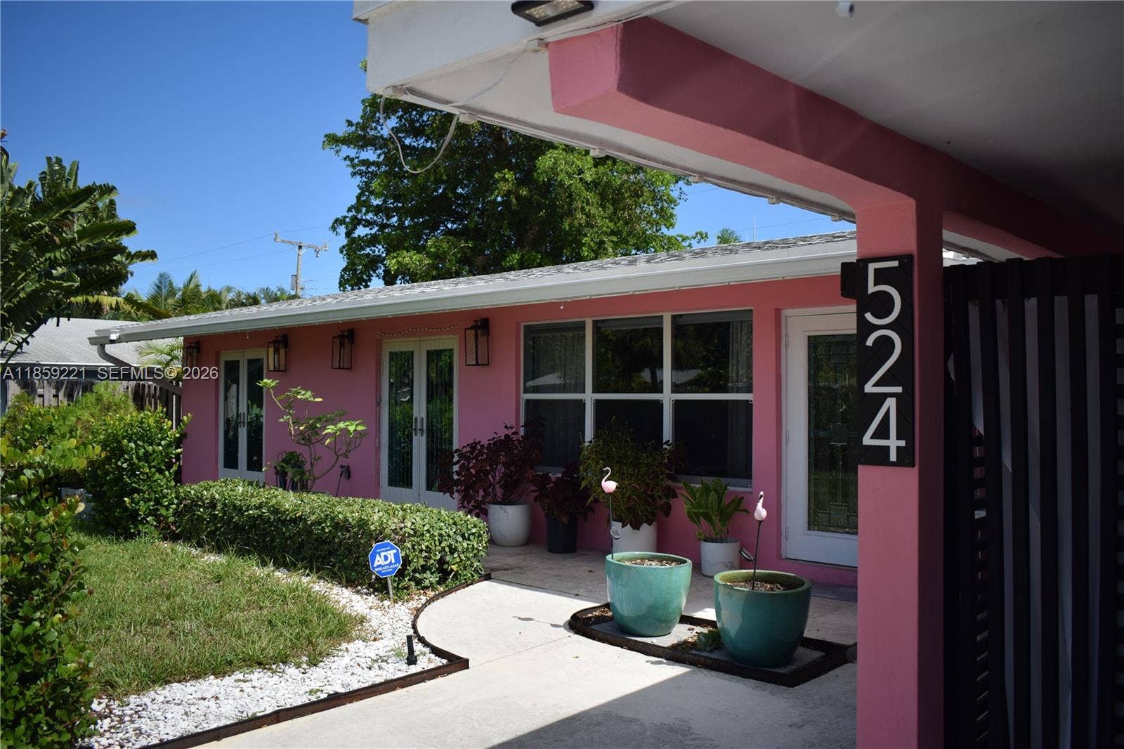 524 NE 27th Drive, Wilton Manors, FL 33334 Easy access to the front entrance with excellent lighting for enhanced safety and convenience