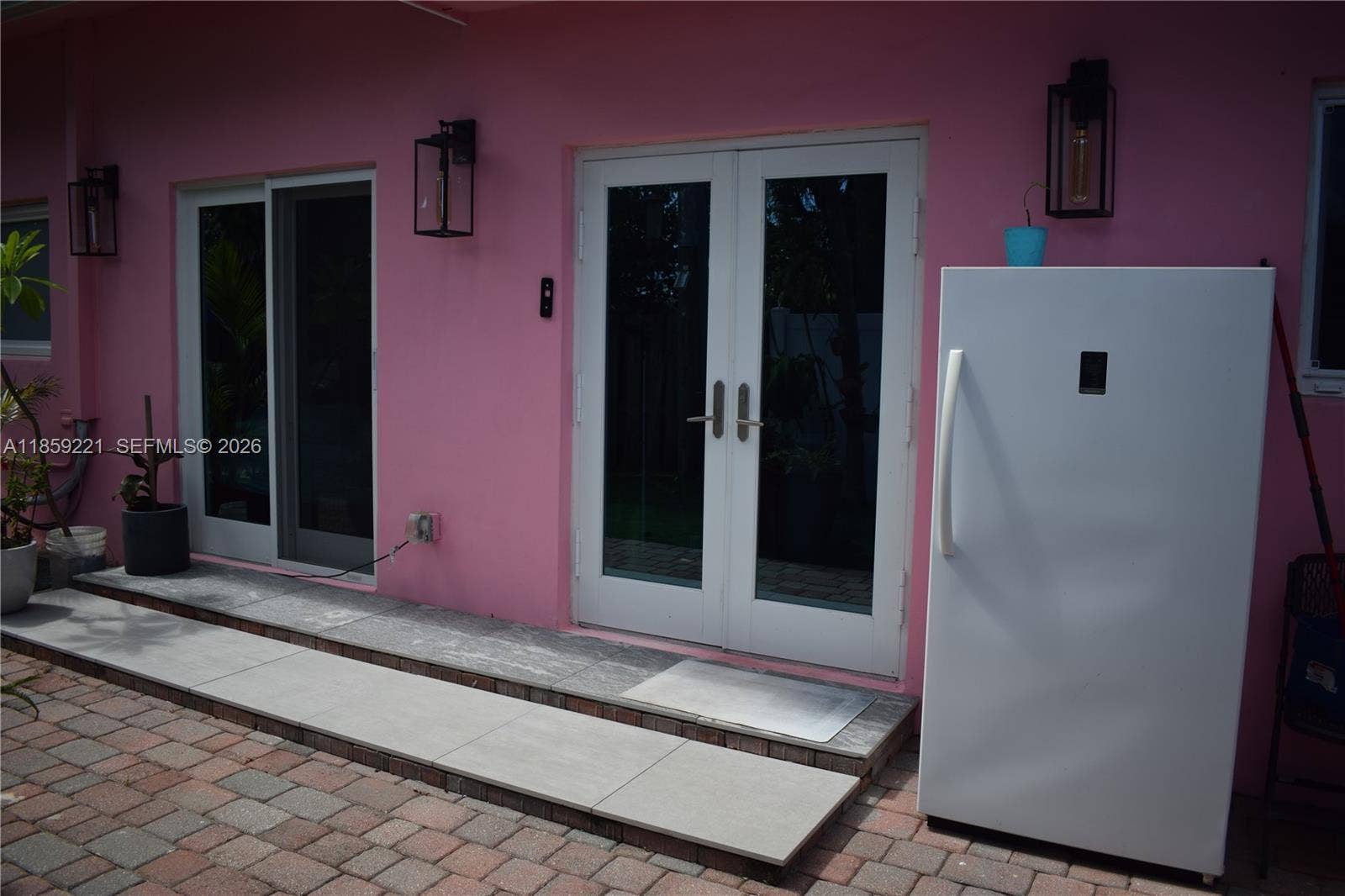 524 NE 27th Drive, Wilton Manors, FL 33334 The home offers several direct connections to the rear patiofrom the kitchen and multiple bedroomsperfect for entertaining or quiet outdoor moments