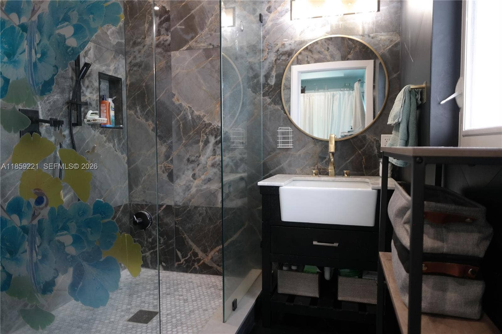 524 NE 27th Drive, Wilton Manors, FL 33334 Sleek en-suite bath with intelligent toilet system and oversized walk-in shower designed for comfort and accessibility