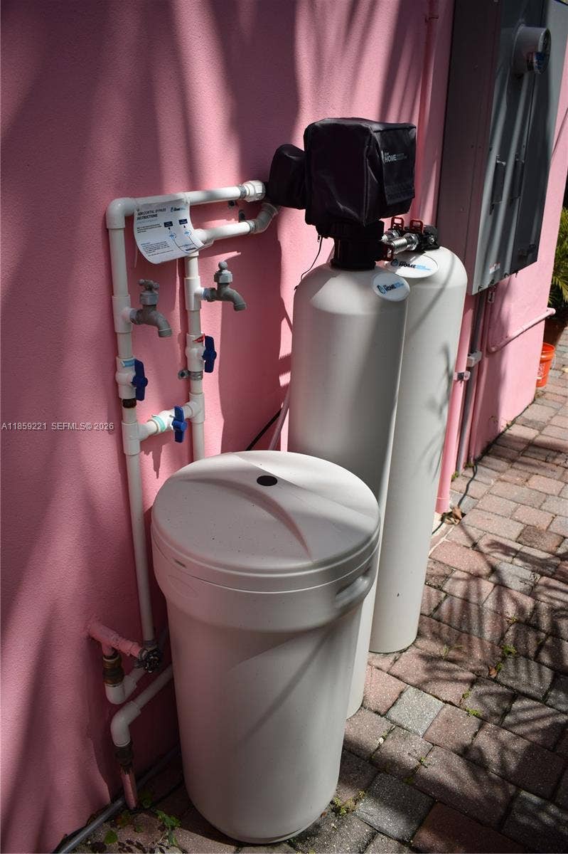 524 NE 27th Drive, Wilton Manors, FL 33334 Live well with a full-property water filtration system featuring a sleek digital display for easy monitoringdelivering purified water to every faucet
