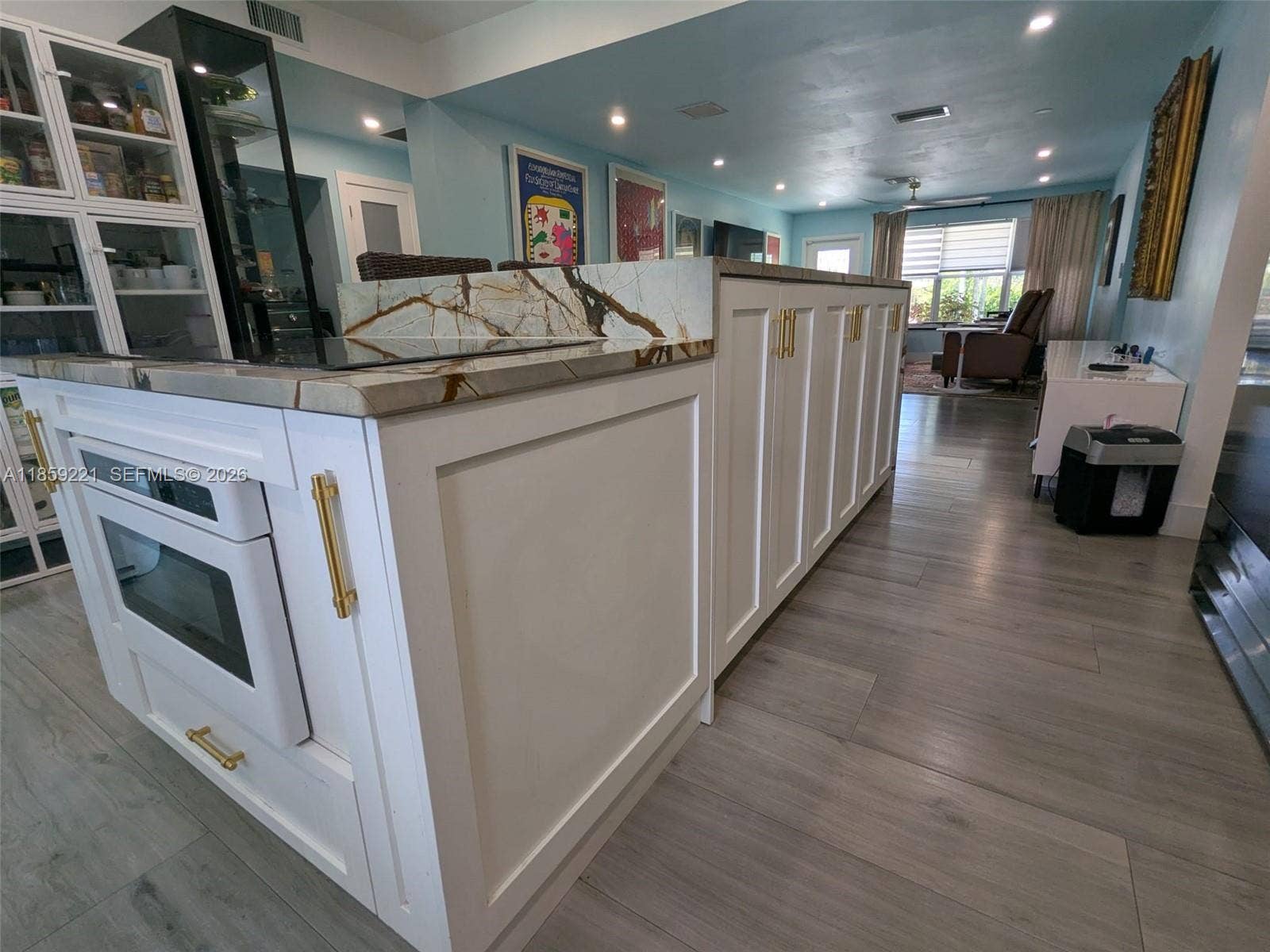524 NE 27th Drive, Wilton Manors, FL 33334 Expansive white cabinets with designer-grade pulls deliver a polished look, blending modern elegance with timeless charm