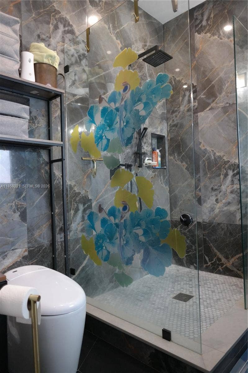 524 NE 27th Drive, Wilton Manors, FL 33334 From smart fixtures to elegant finishes, every detail in the bathroom is designed to deliver a luxurious, spa-quality experience