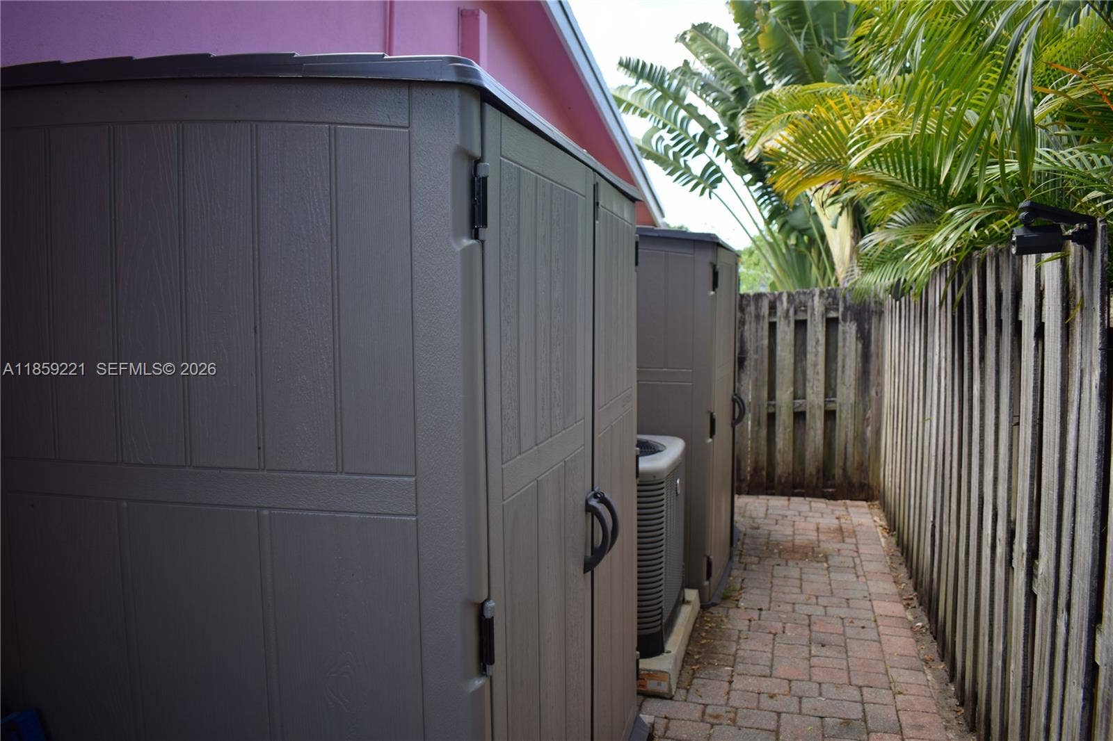 524 NE 27th Drive, Wilton Manors, FL 33334 A dedicated side corridor ensures easy and discreet access to the backyard from the exterior of the home.