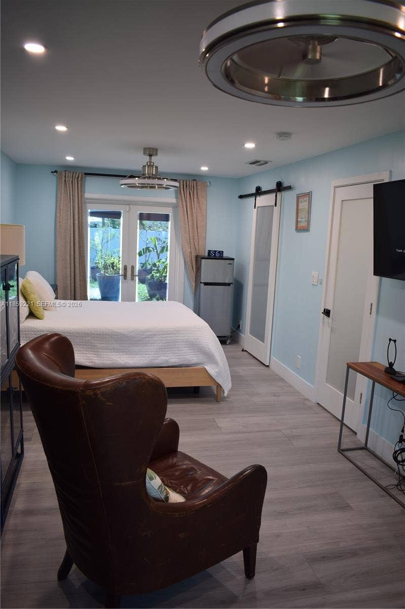 524 NE 27th Drive, Wilton Manors, FL 33334 Spacious primary bedroom with flat ceiling, recessed lighting, double modern ceiling fans; and added bonus space perfect for reading, working from home, or relaxing