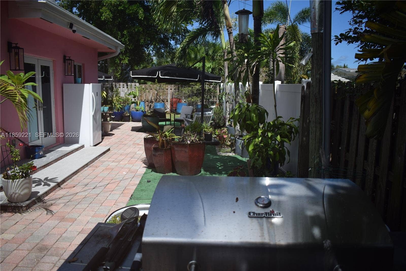 524 NE 27th Drive, Wilton Manors, FL 33334 Expansive backyard offers multiple zones for creating inviting outdoor retreats